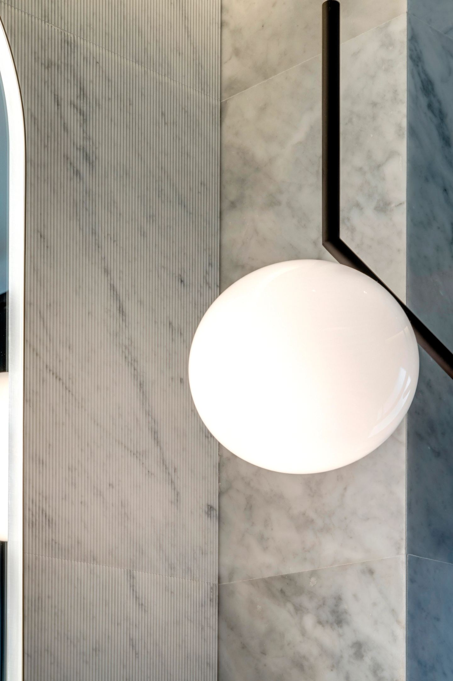 Opal glass globe against the Carrara marble