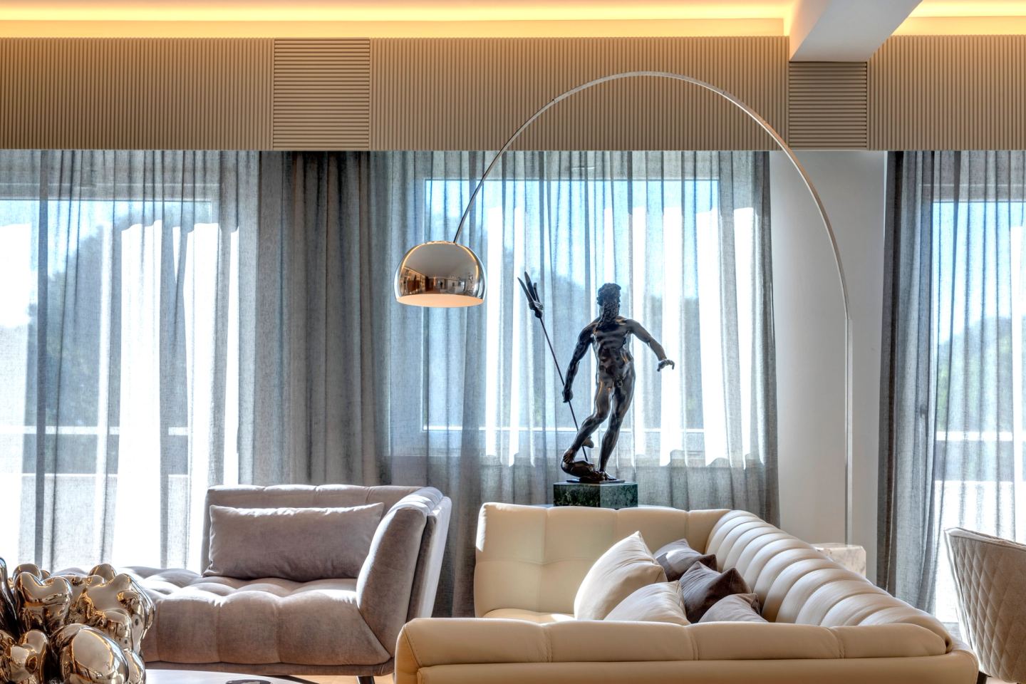 Seating group and sculpture against the sheer curtains