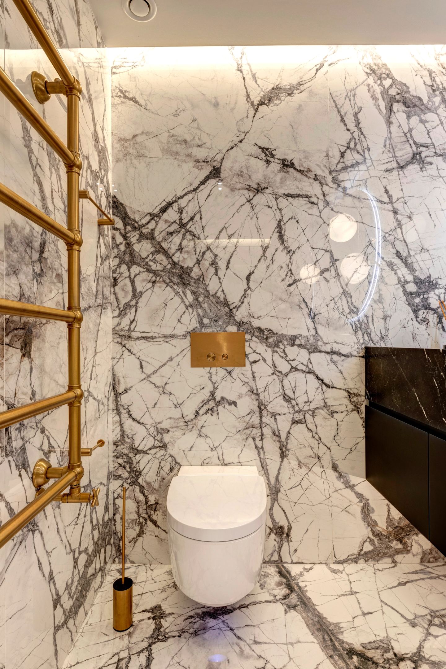 Marble, brass and the black vanity in one frame