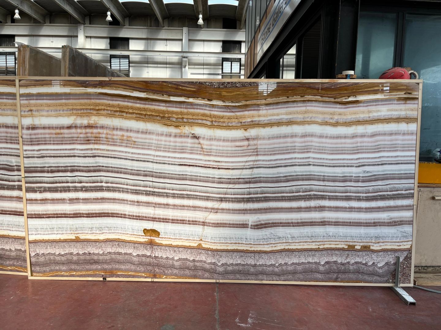 An onyx slab standing at the stone yard