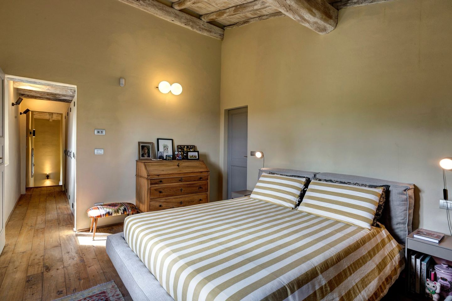 The master bedroom from the corridor, the wall light above the secretaire