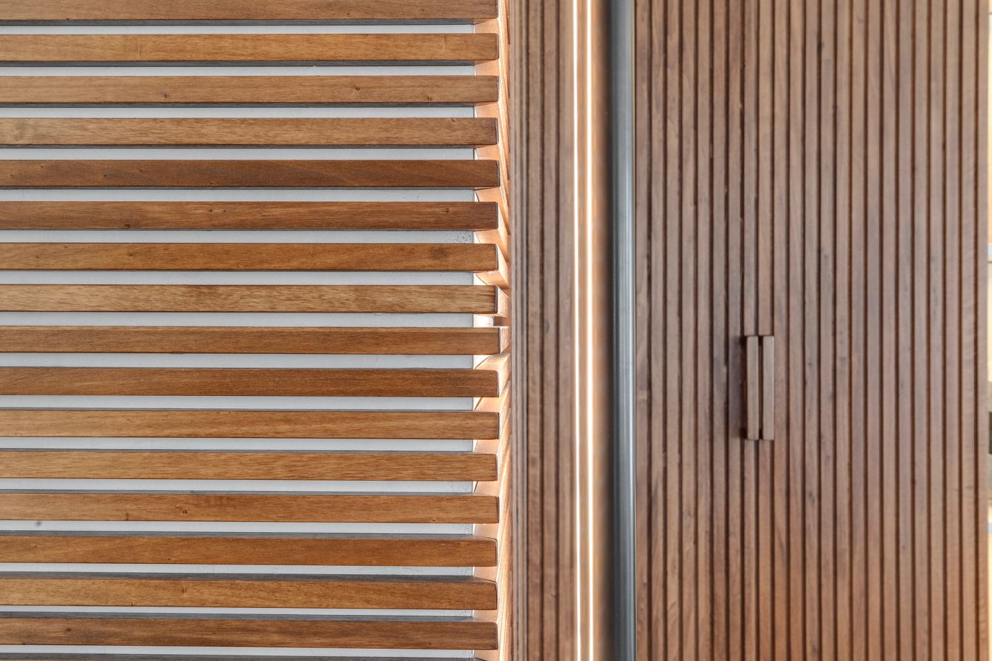 Horizontal ribbing across the cabinet fronts, close