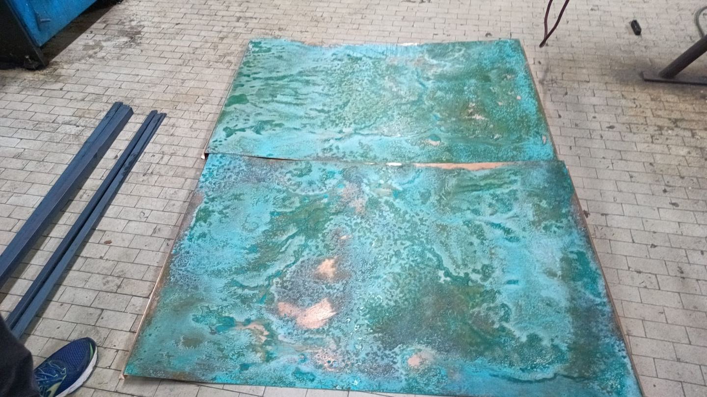 A copper sheet taking on its green patina
