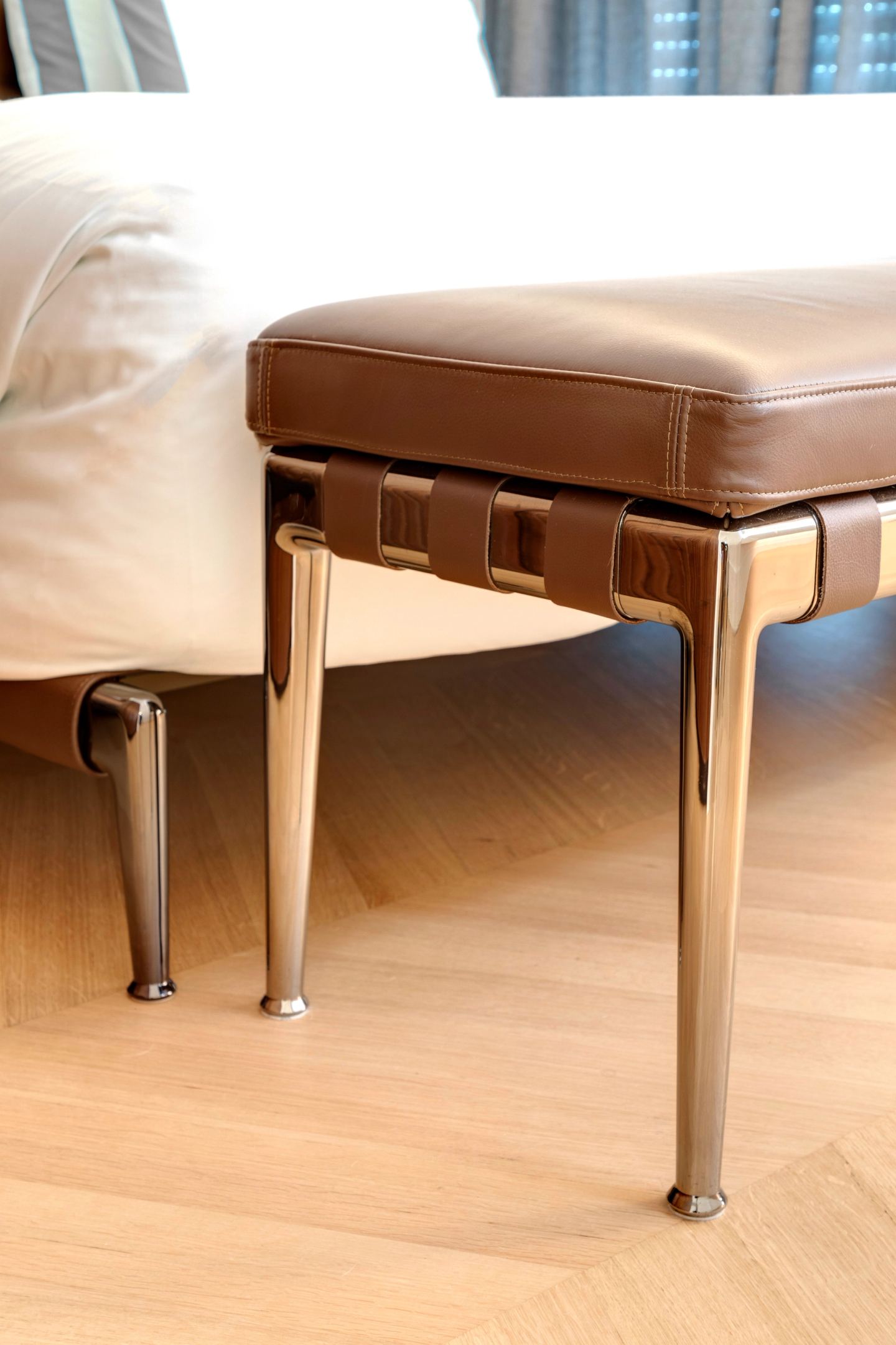 Leather bench at the foot of the bed