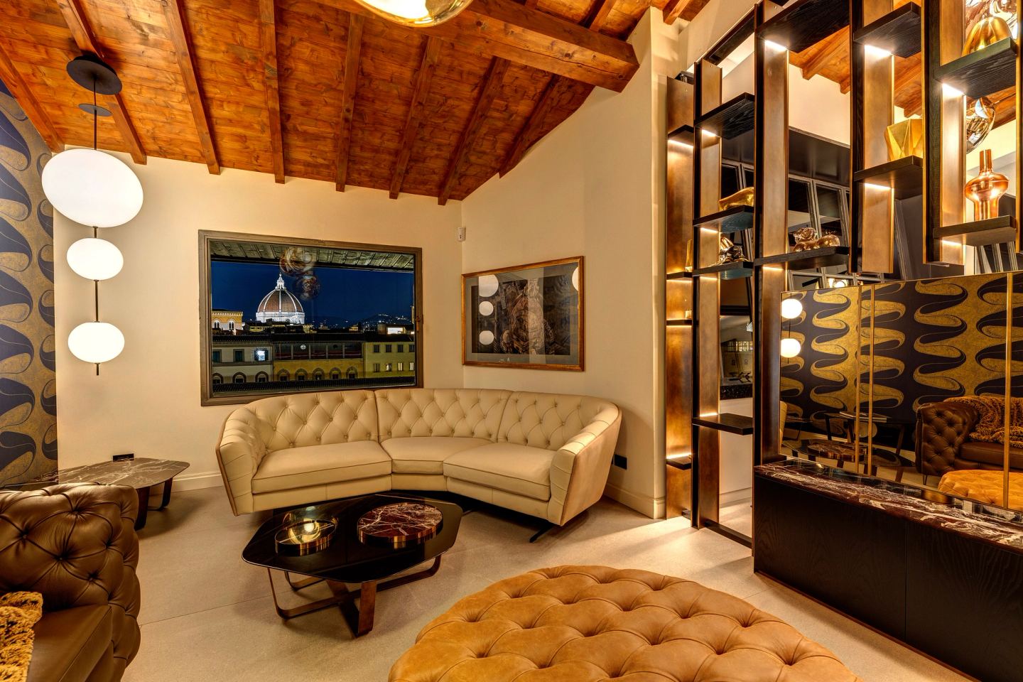 The living room at night, a lit picture above the sofa