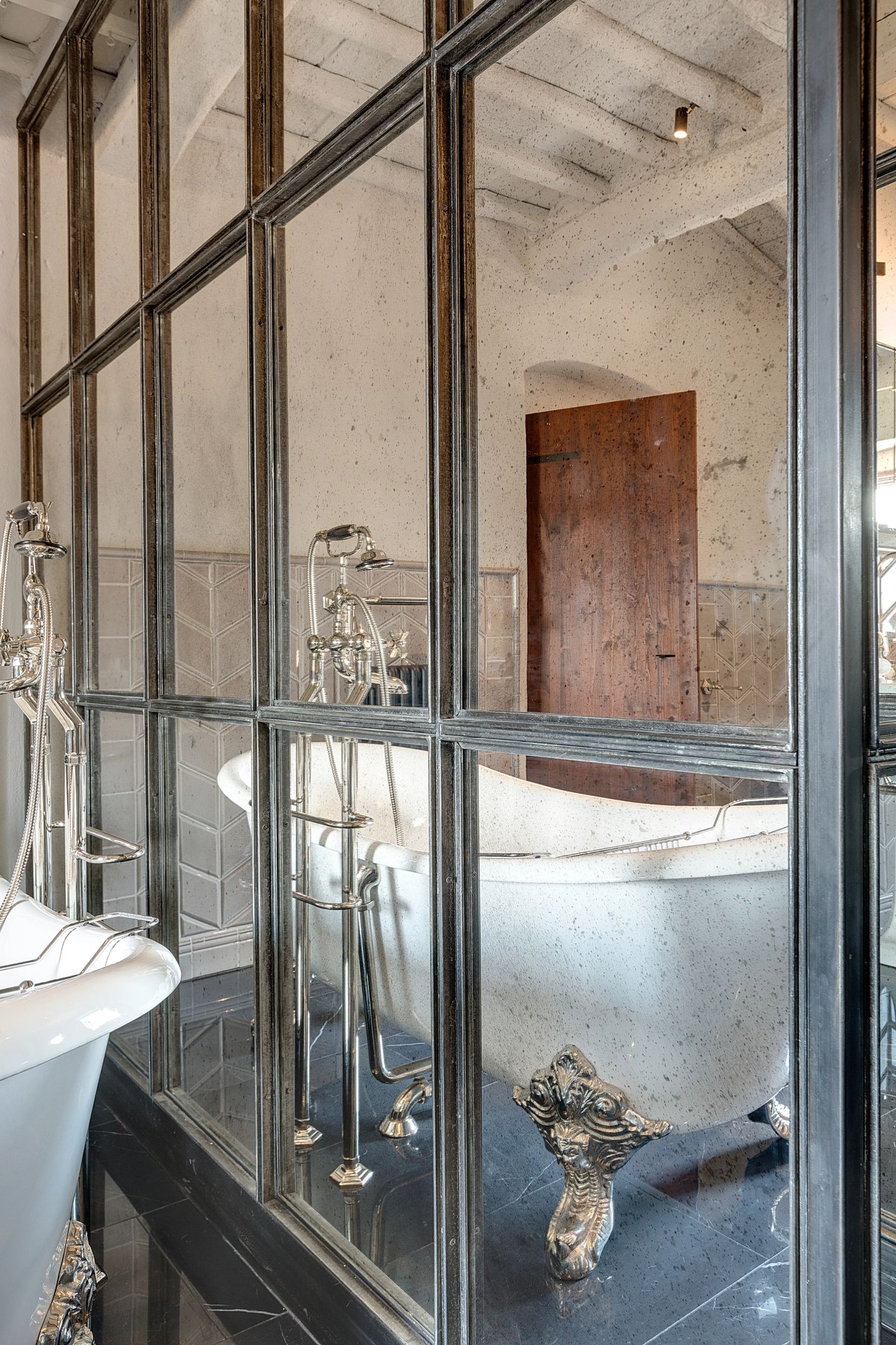 The bath returned by the antiqued mirror