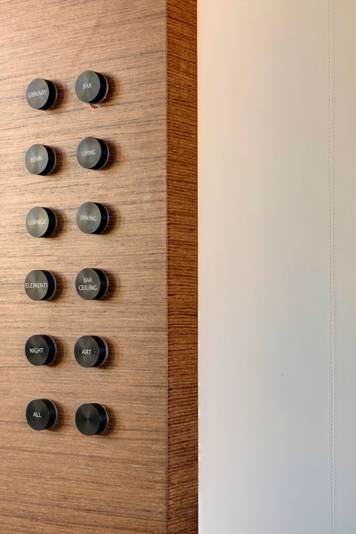 The bank of switches set into the oak panelling
