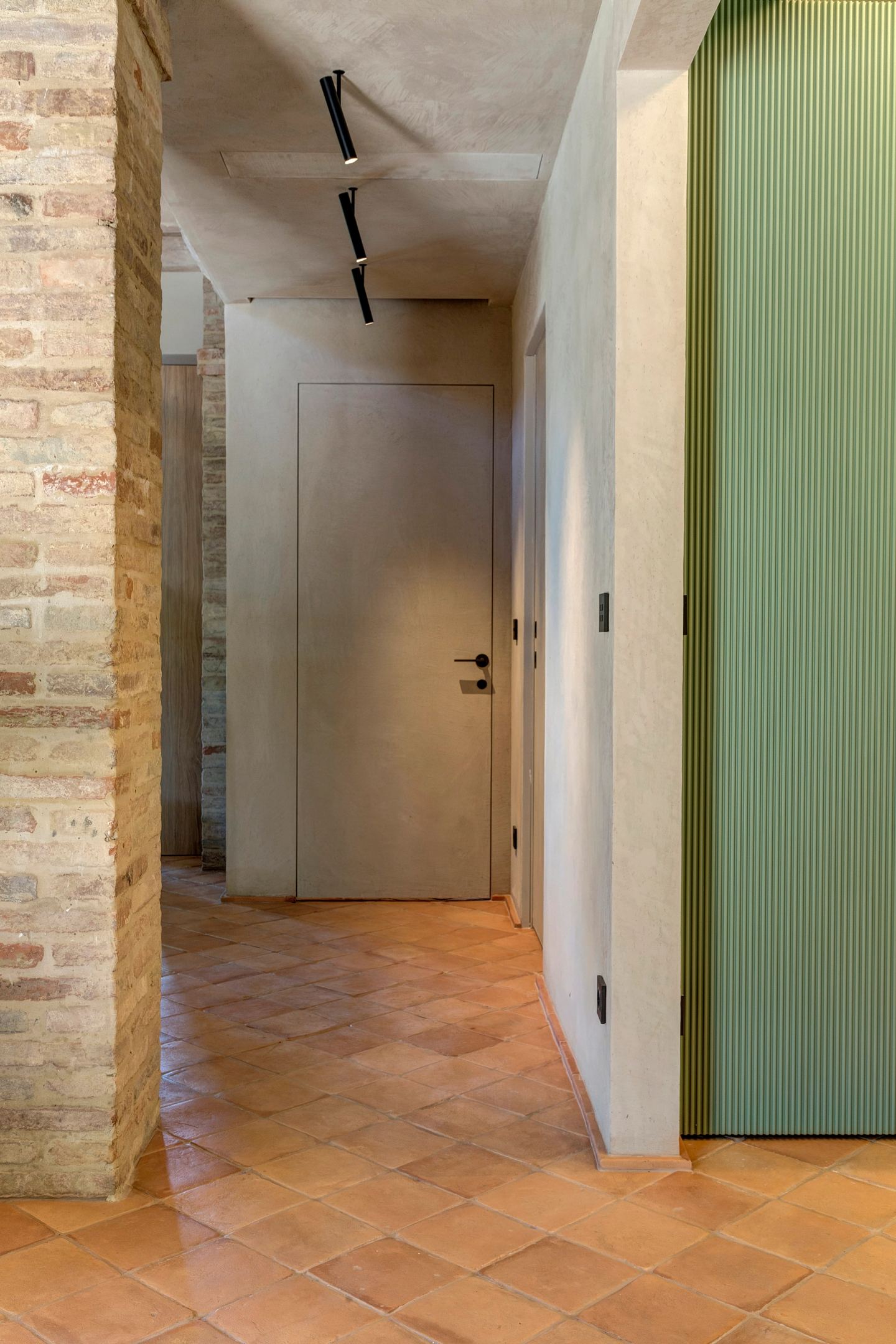 The corridor and the run of doors