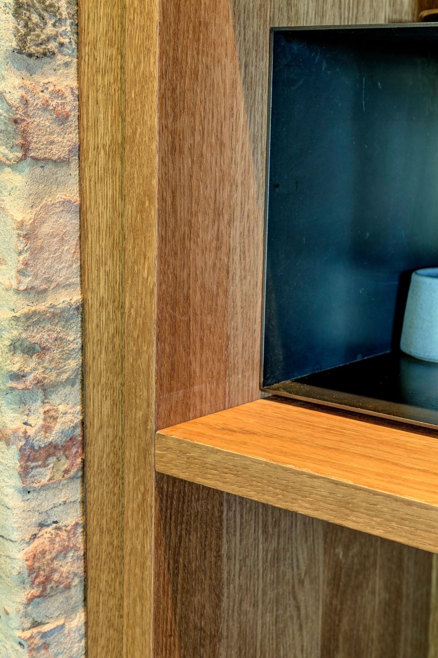 A lit niche cut into the oak run