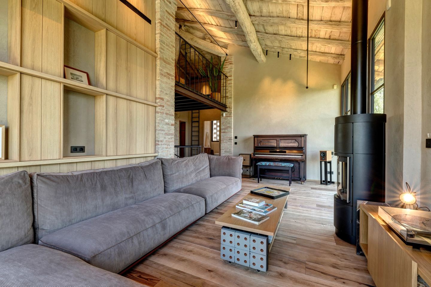 The sofa and the shelving behind it