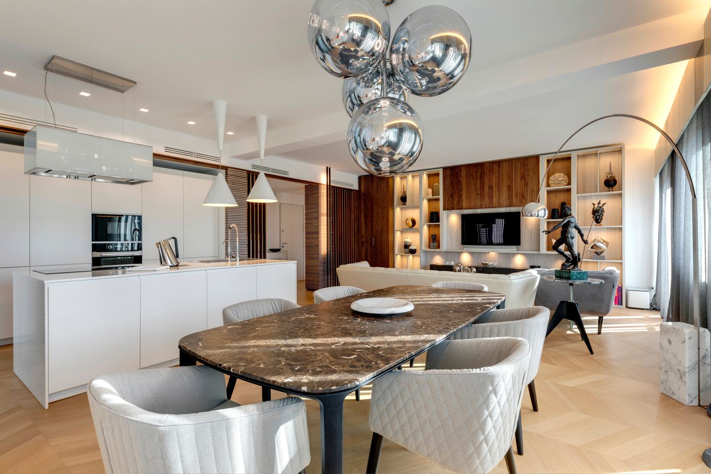 Dining and kitchen from the living room, globes lit