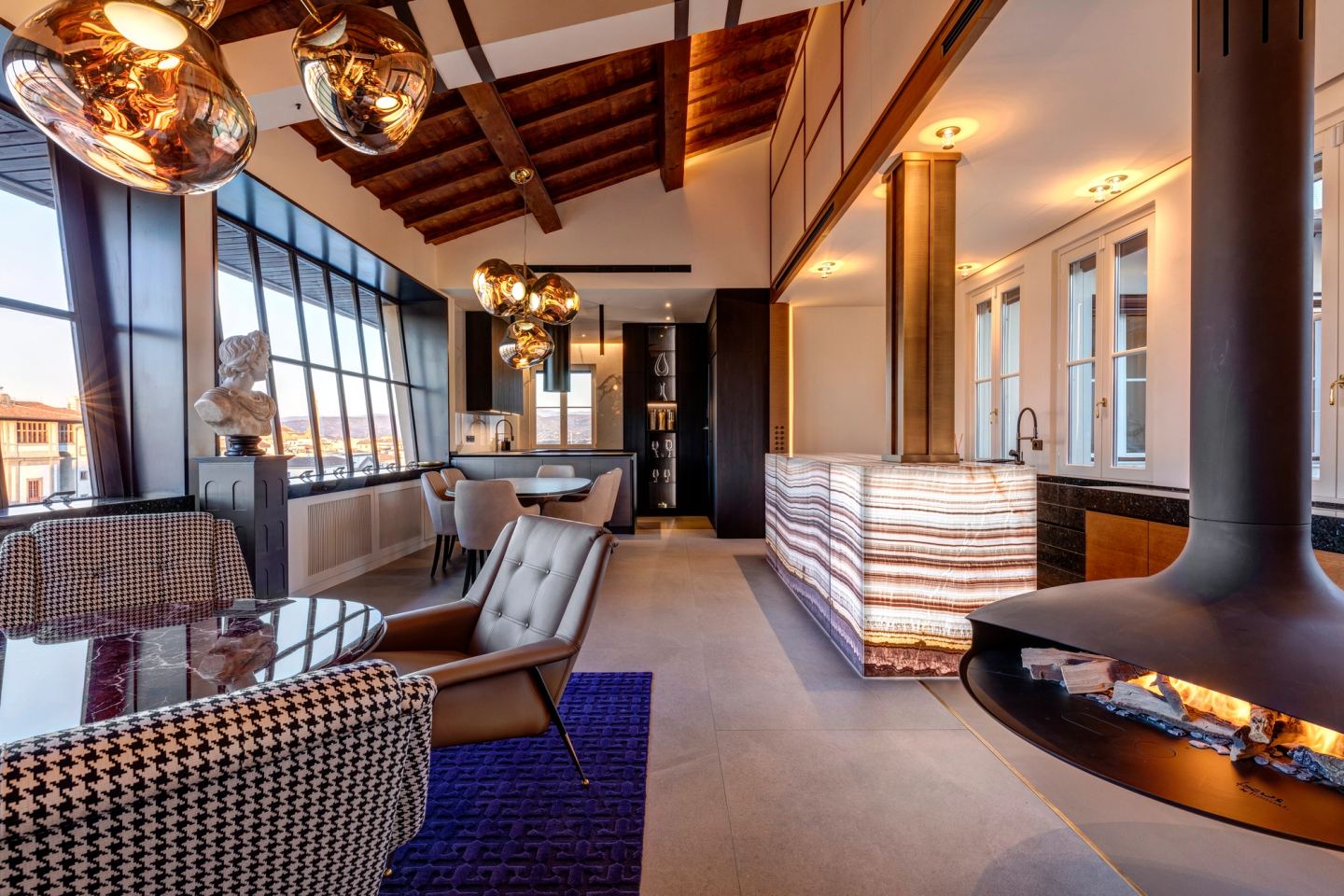 The full length of the living room, fireplace at its centre