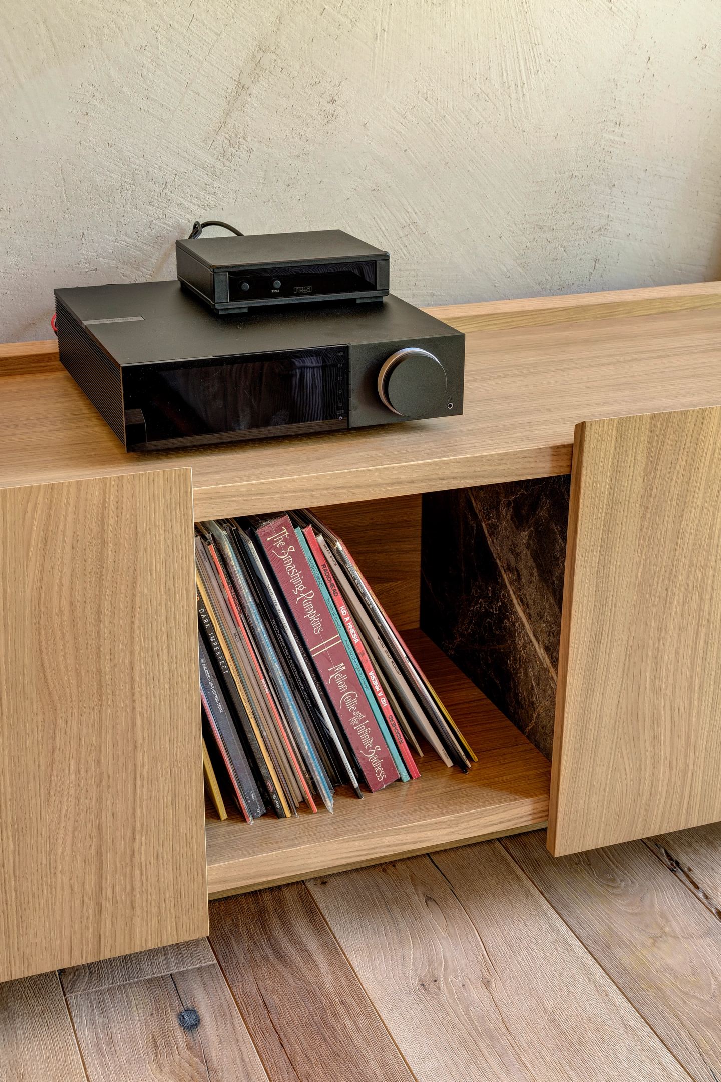 The turntable and the records below it