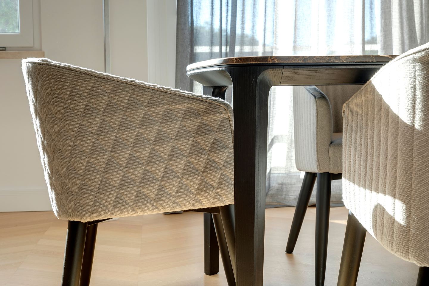 Chair backs and table leg, detail of the dining group