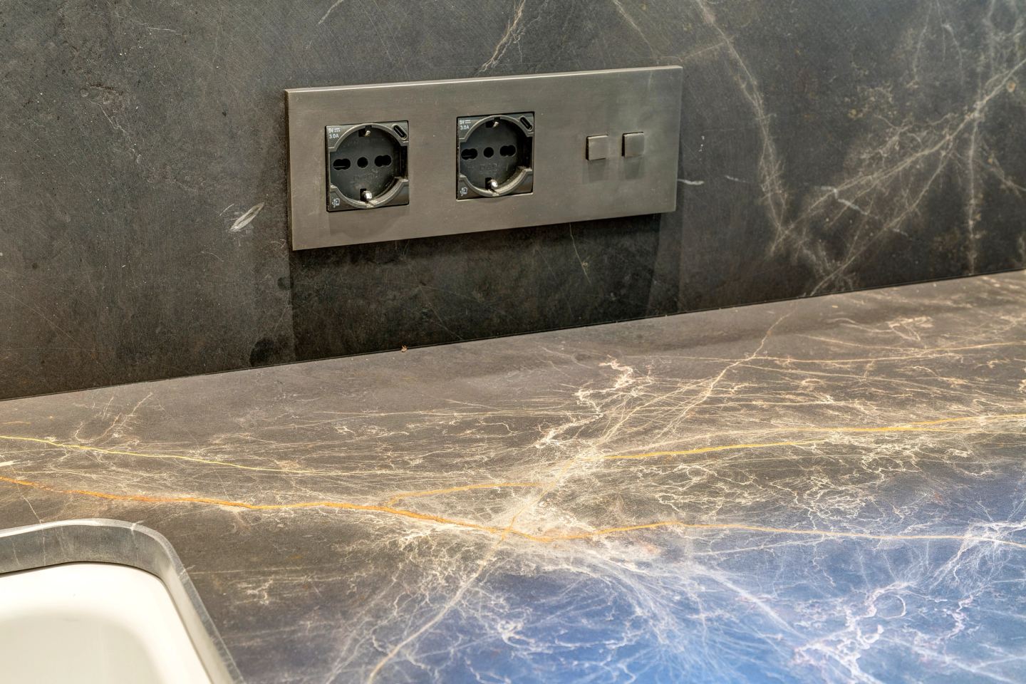 Sockets set flush into the marble worktop