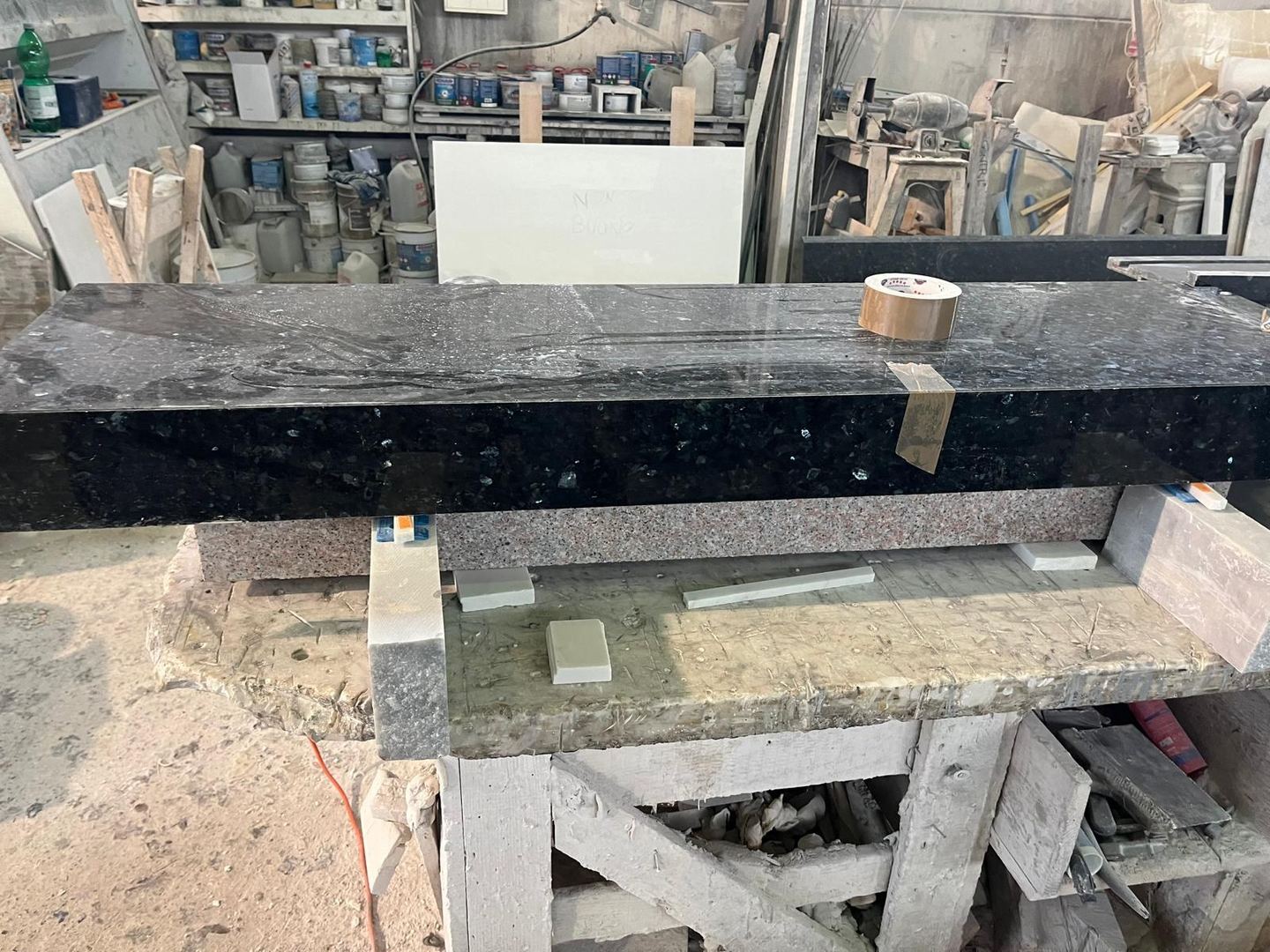 A black stone top being prepared