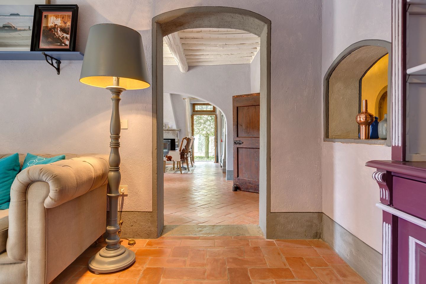 A floor lamp lighting the way through