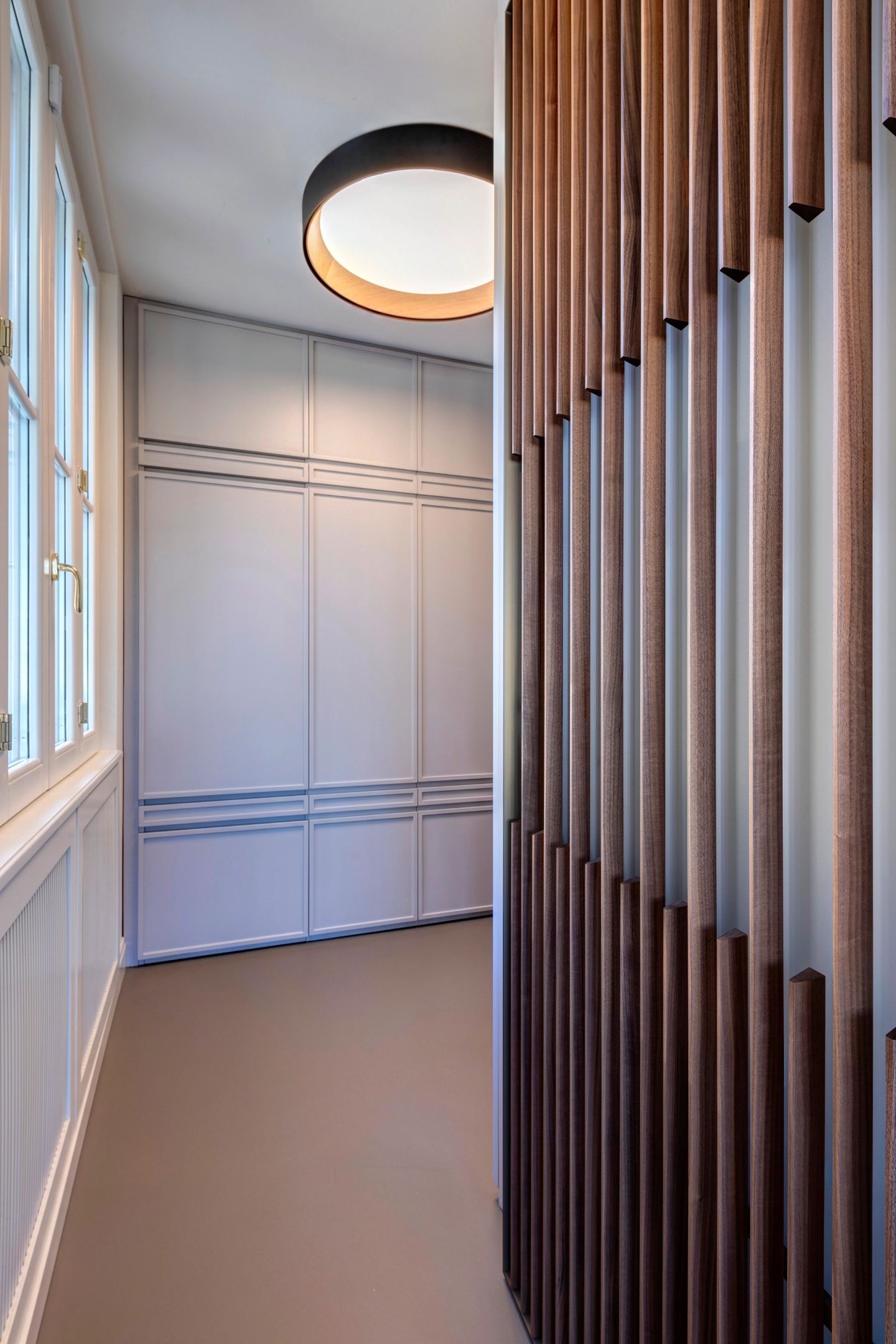The slatted screen beside the round ceiling light