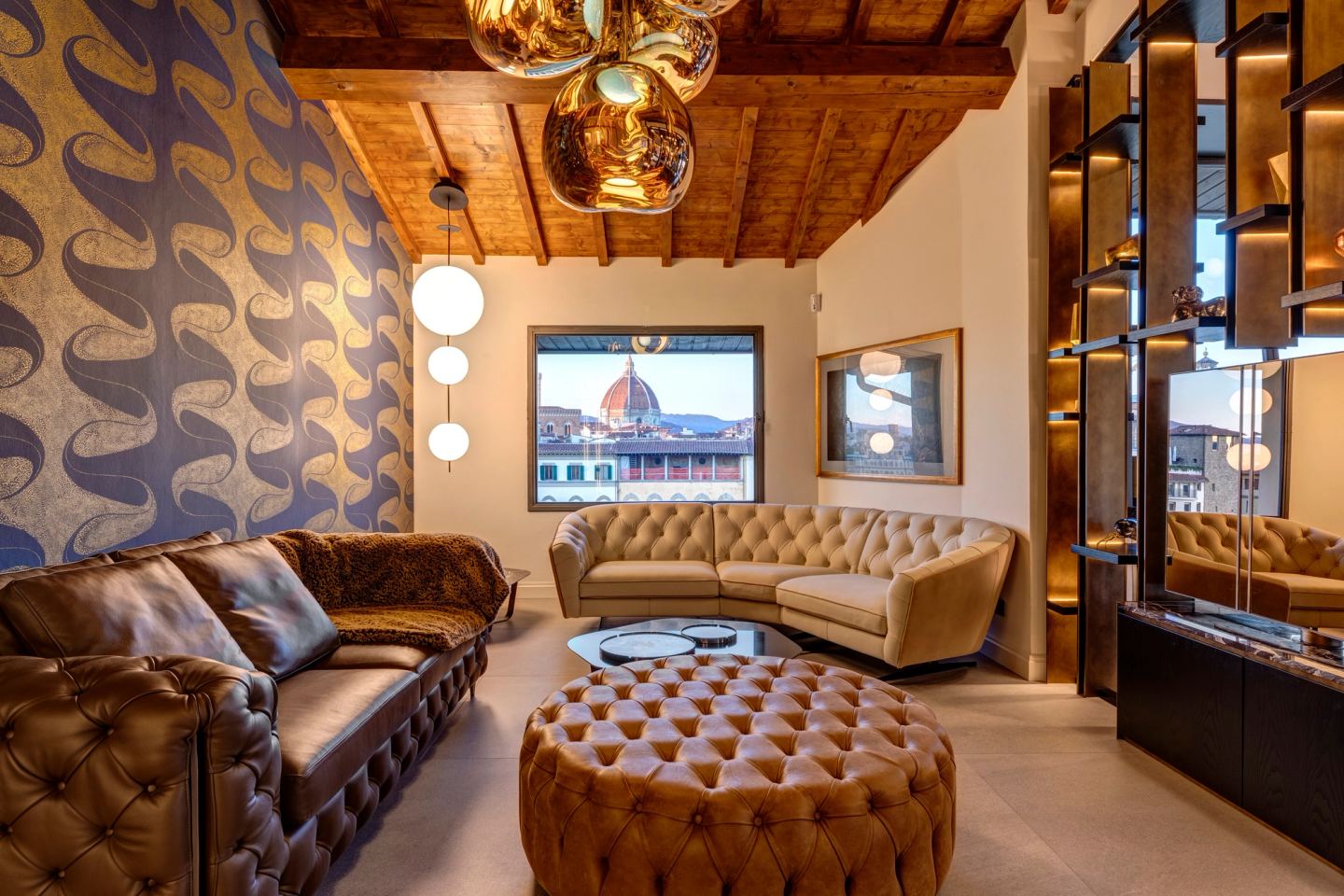 Sofas and ottoman under the beams, Florence through the glass