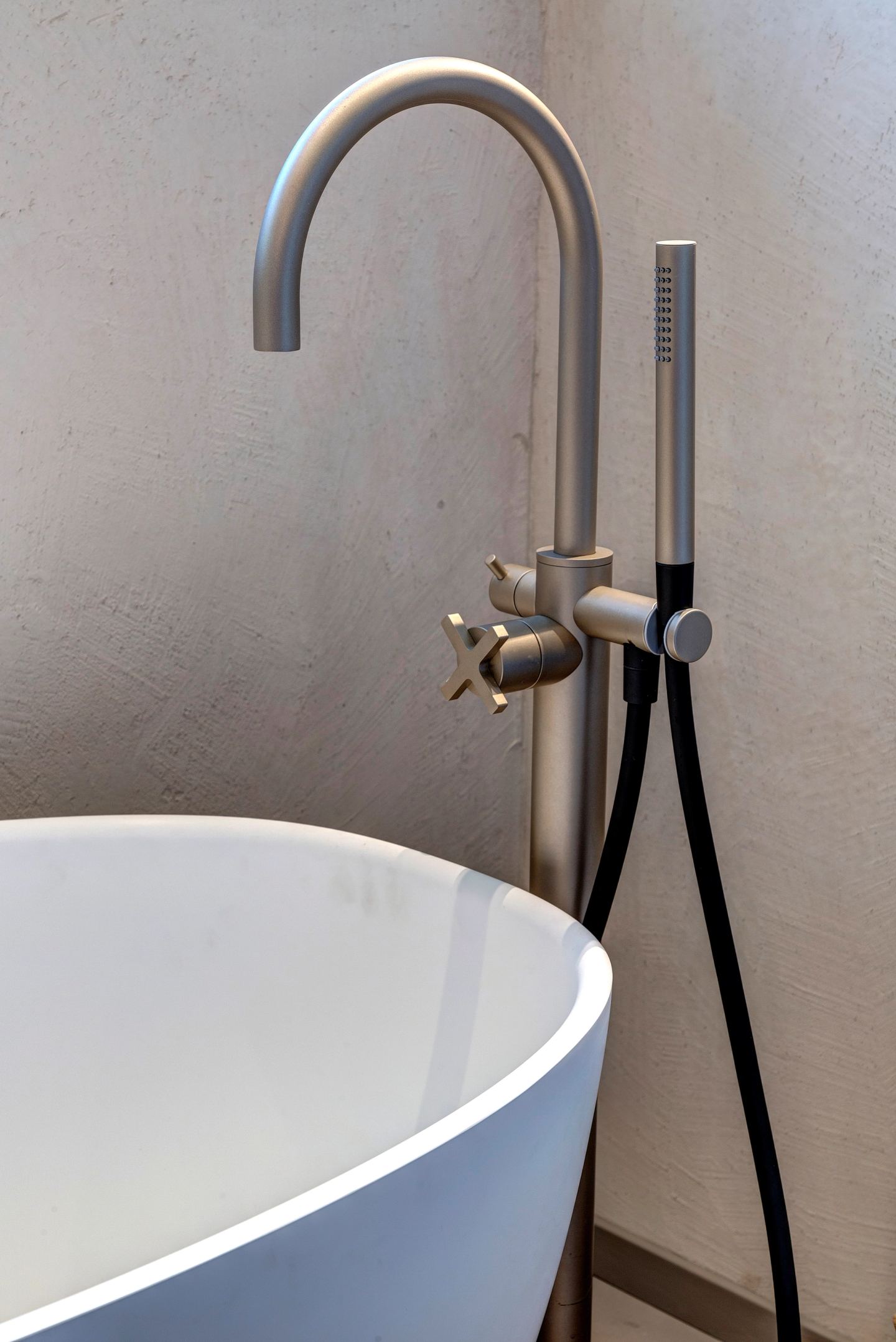 The floor-standing tap and its handset