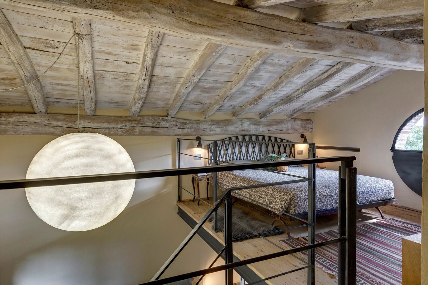 The moon pendant glowing over the stairwell
