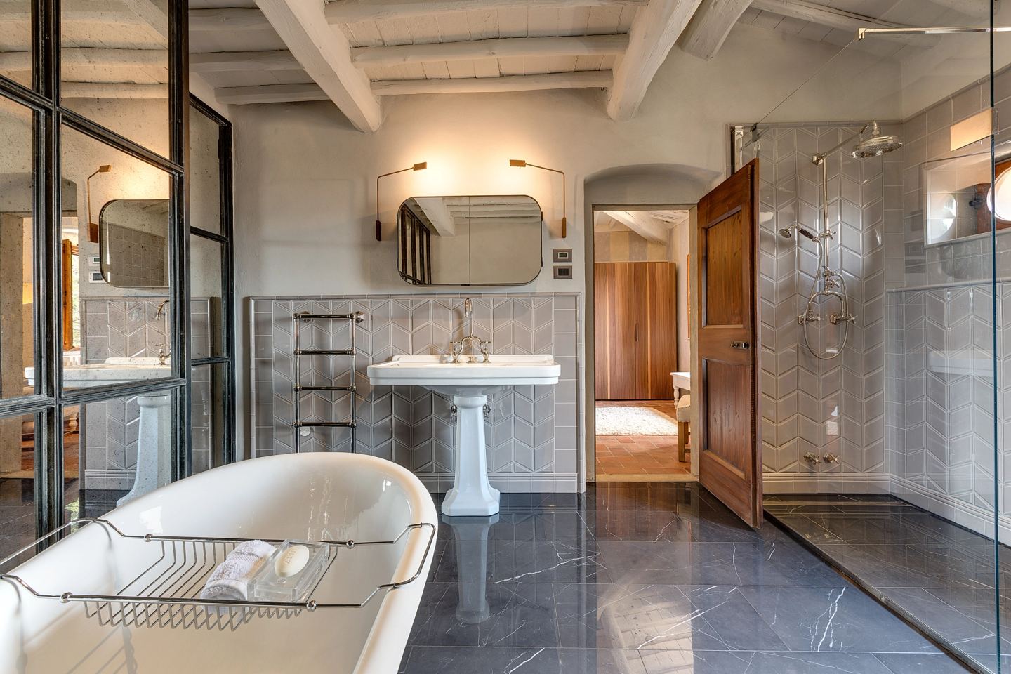 Basin, bath and the cypress-lined door beyond