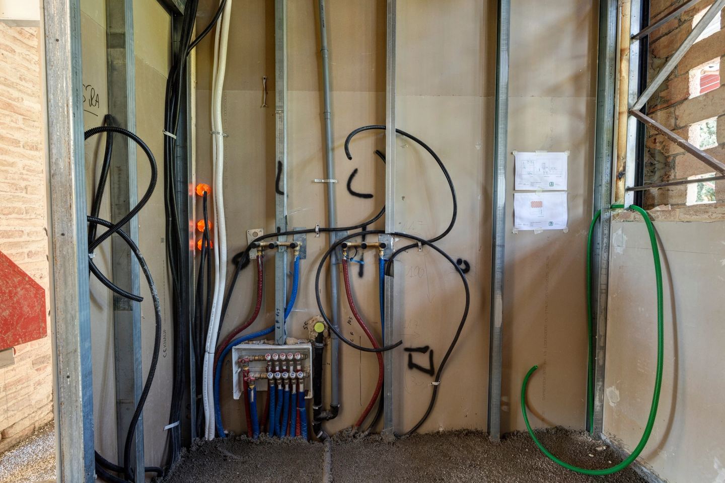 Pipework and manifolds before the walls were closed