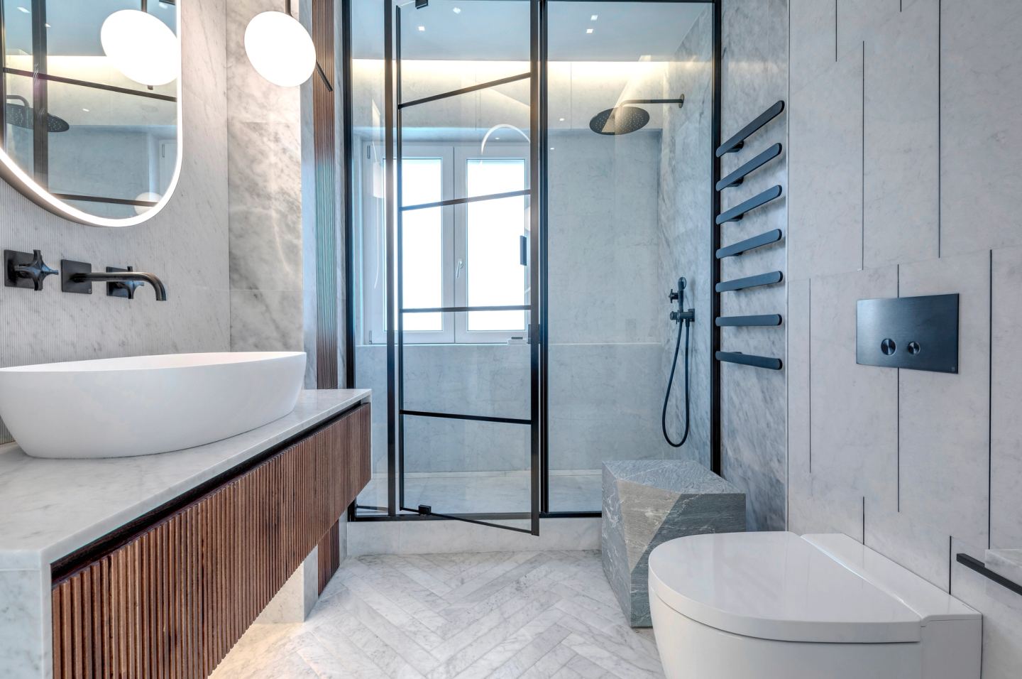 The full length of the room, vanity to shower
