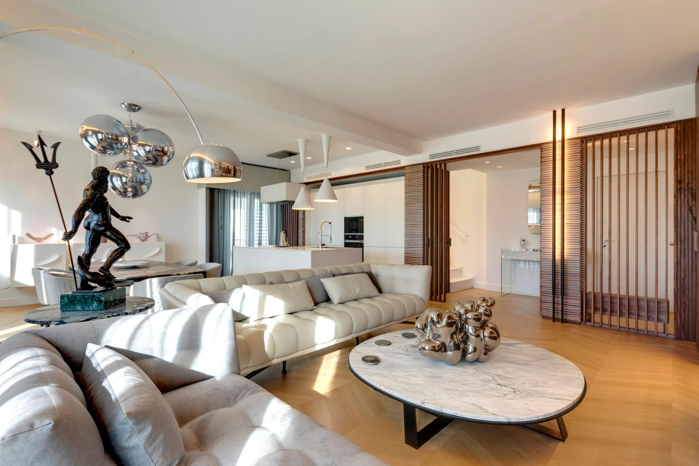 Sofas facing the TV Wall, slatted screen closing the room at the far end
