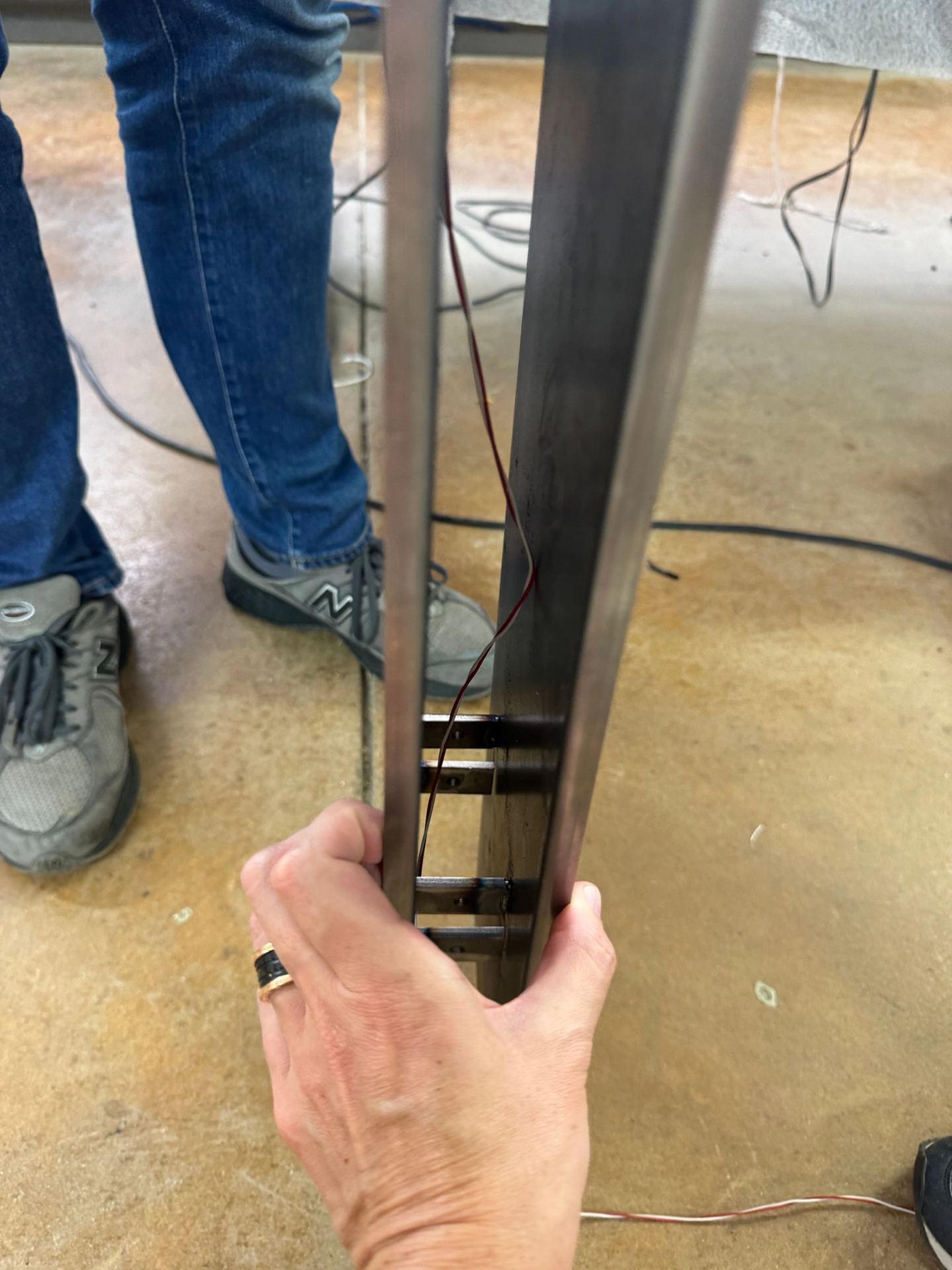 An upright with its light channel, held for inspection
