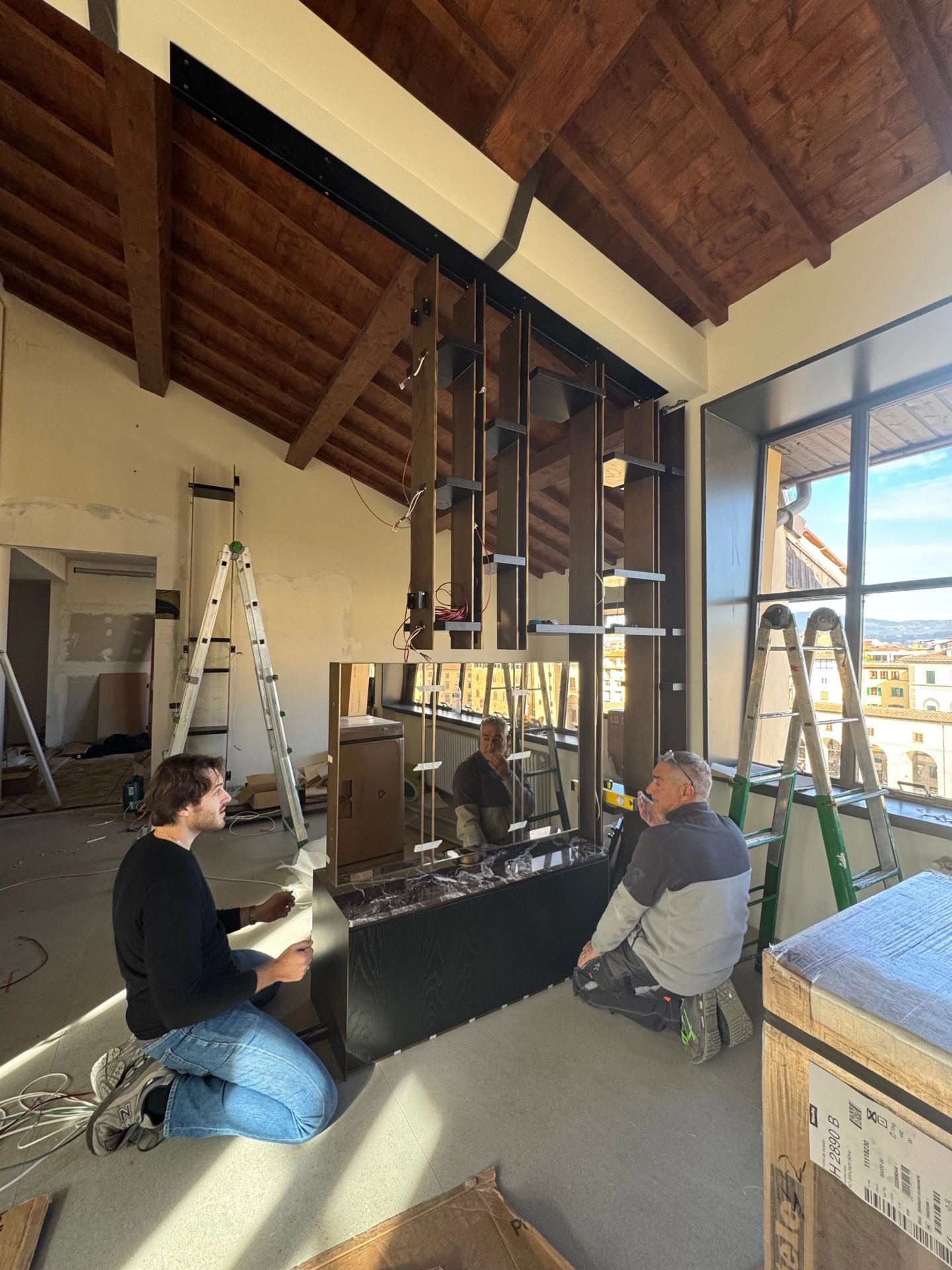 Assembling the base of the library in the living room