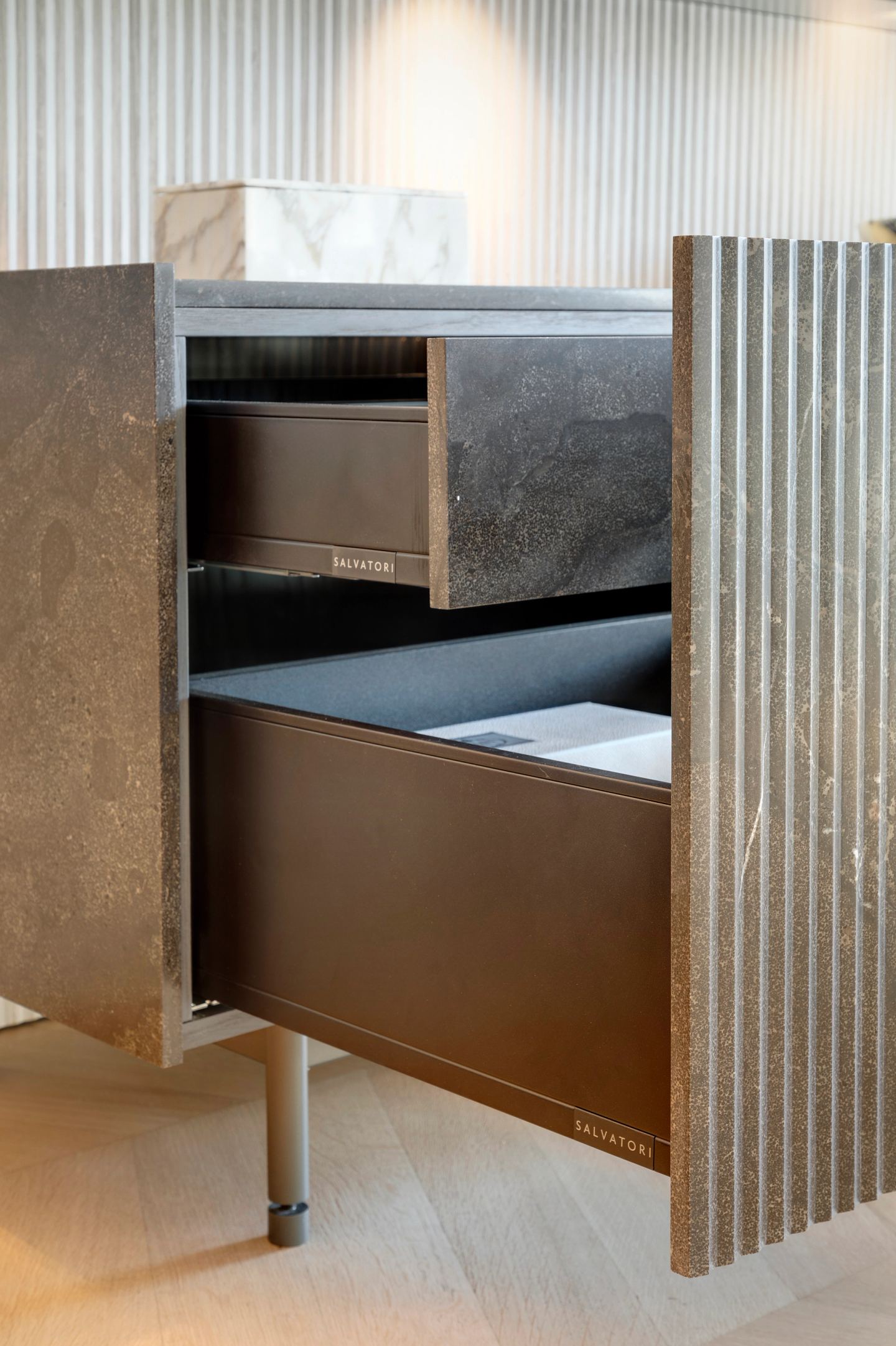 Drawer open in the stone sideboard, leather-lined