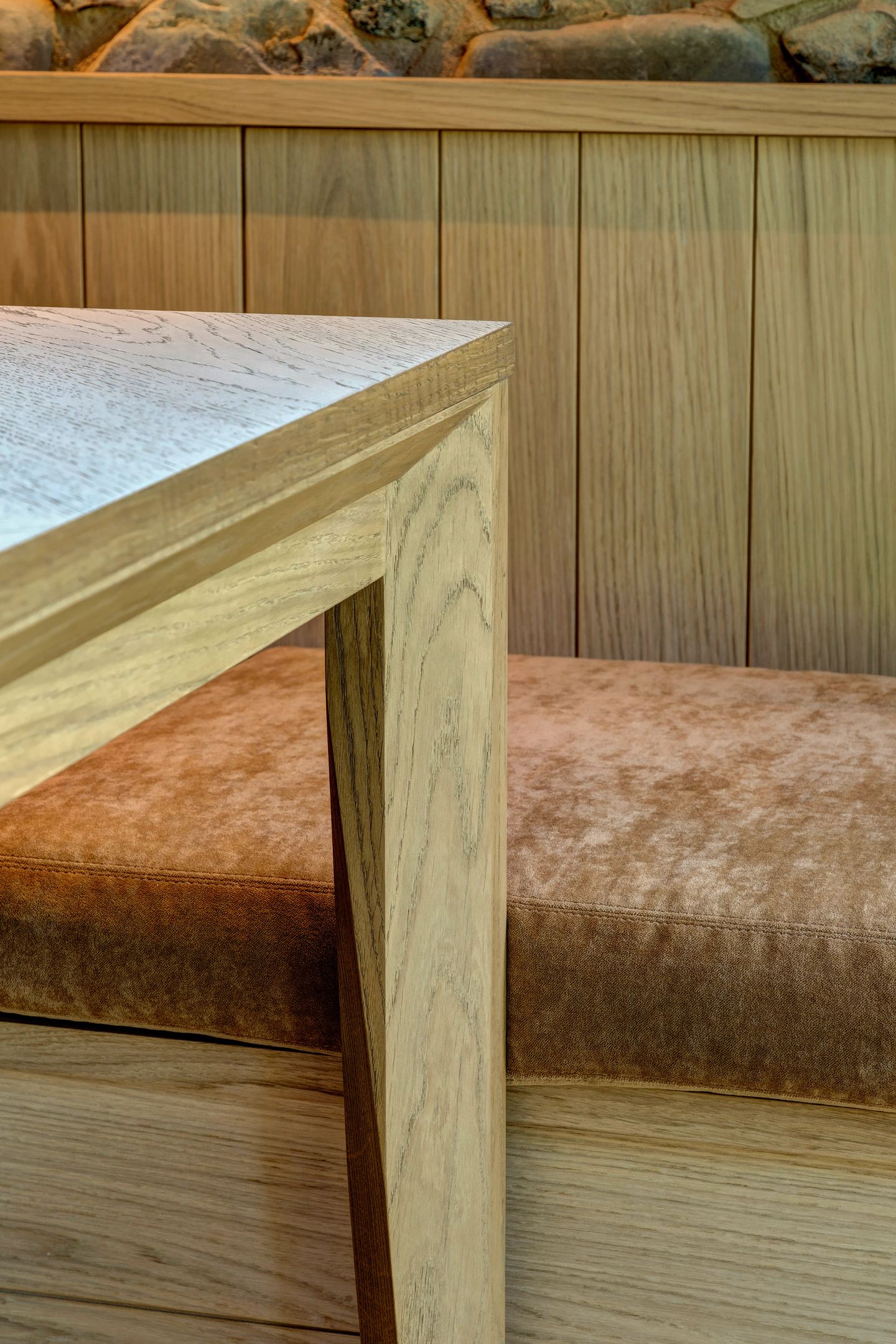 The oak table and the bench drawn under it
