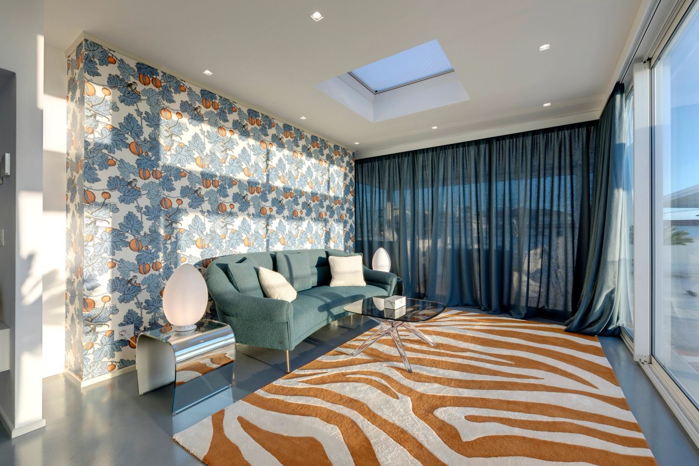 The room from the corner, daylight falling from the skylight