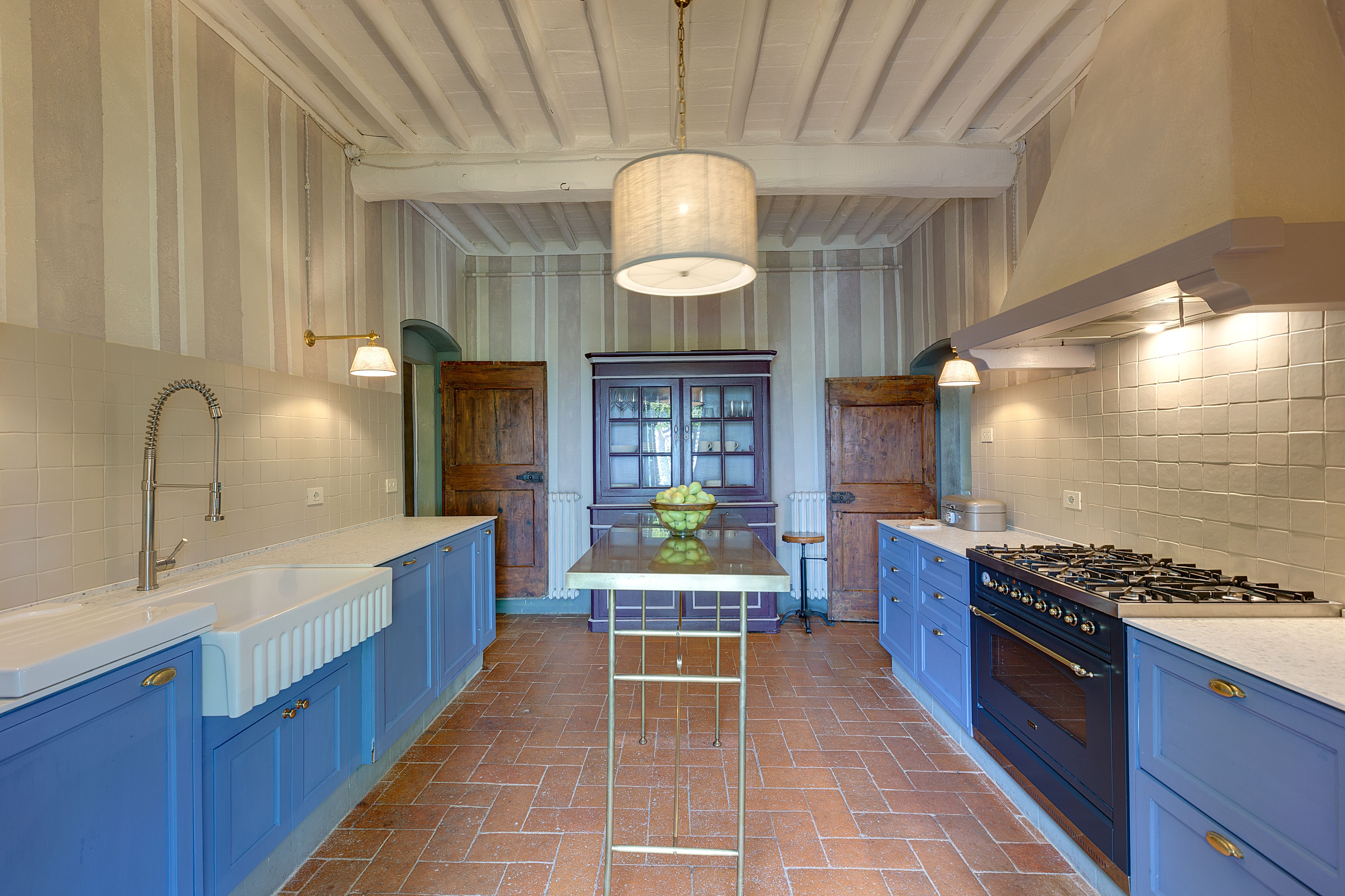The English sink and the blue run under the vaulted ceiling