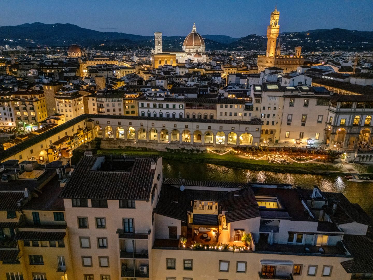 Ponte Vecchio and the lit embankment from the air