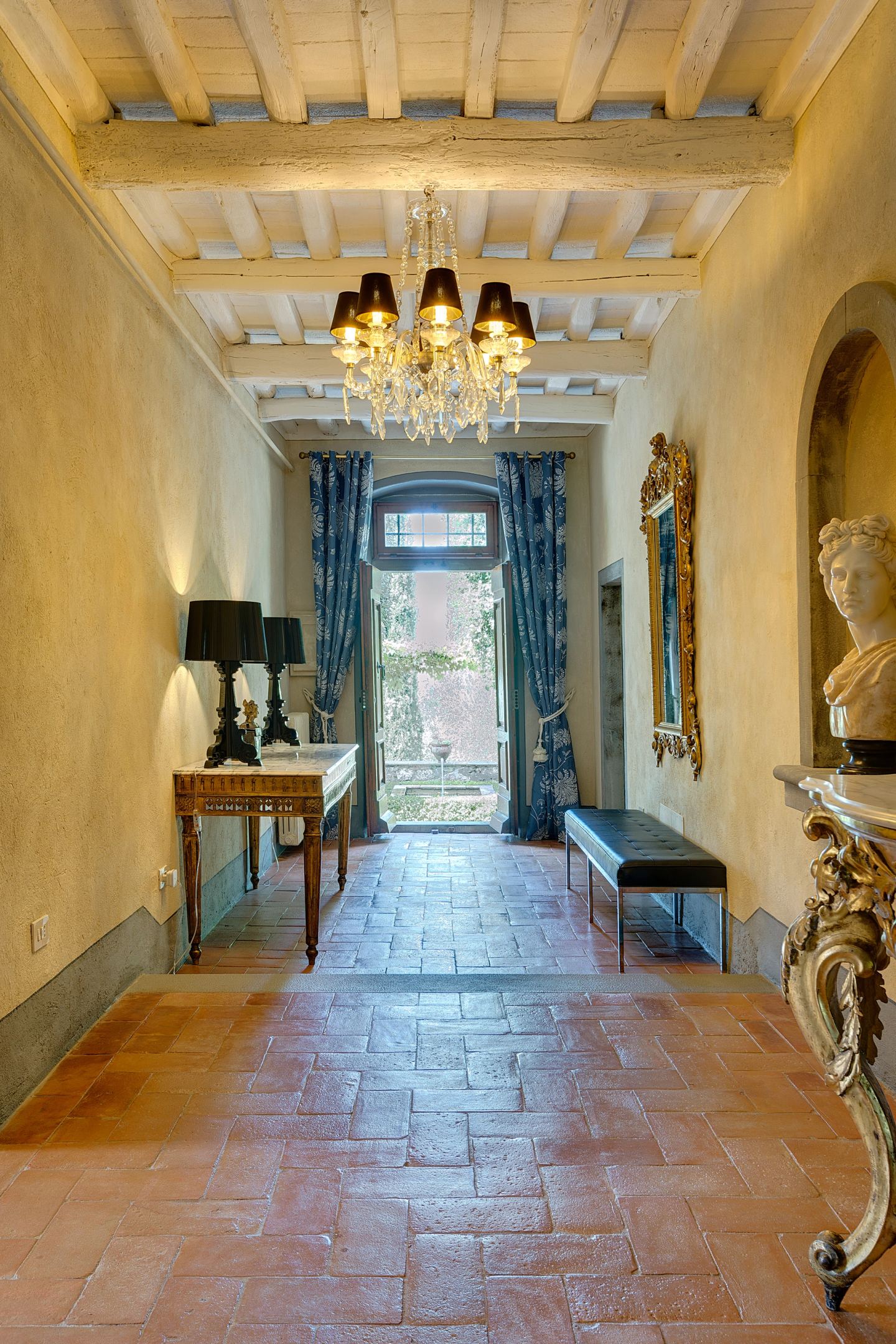 The entrance hall, chandeliers down its length