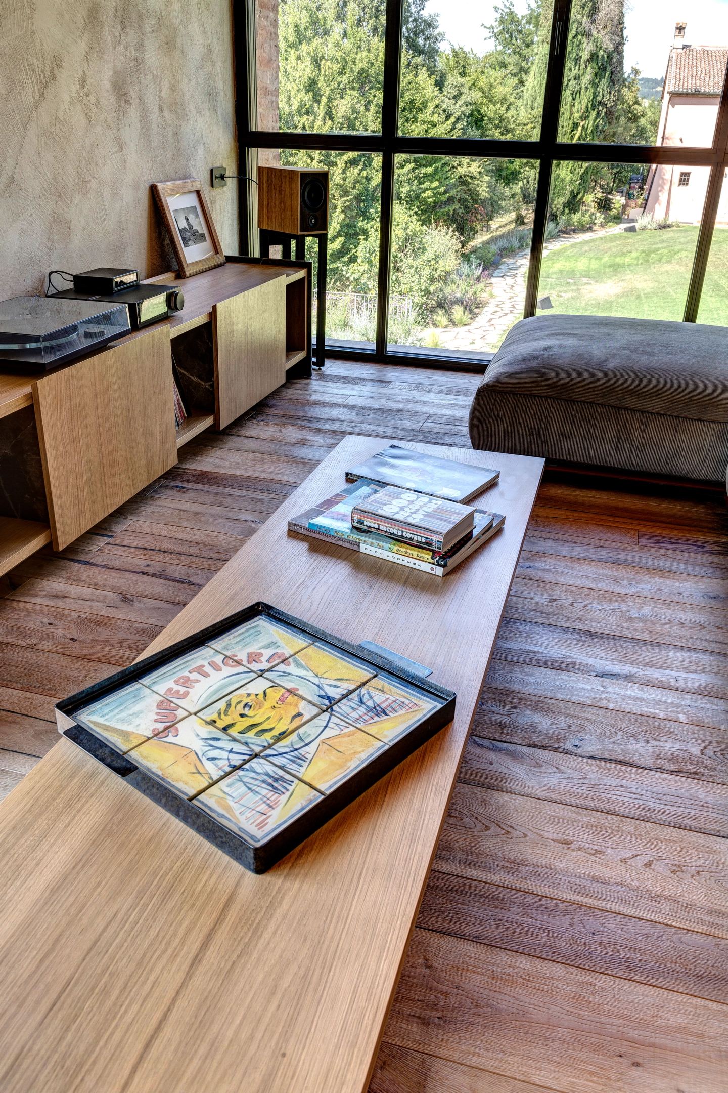 A book left on the sill, the garden beyond