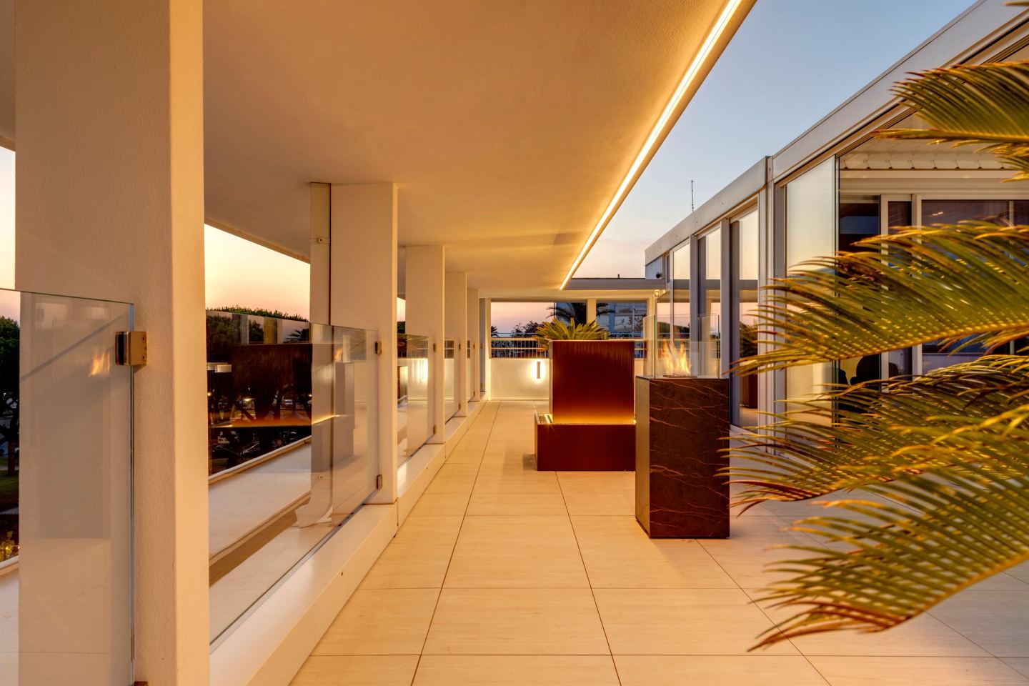 The colonnade at dusk, light in the soffit