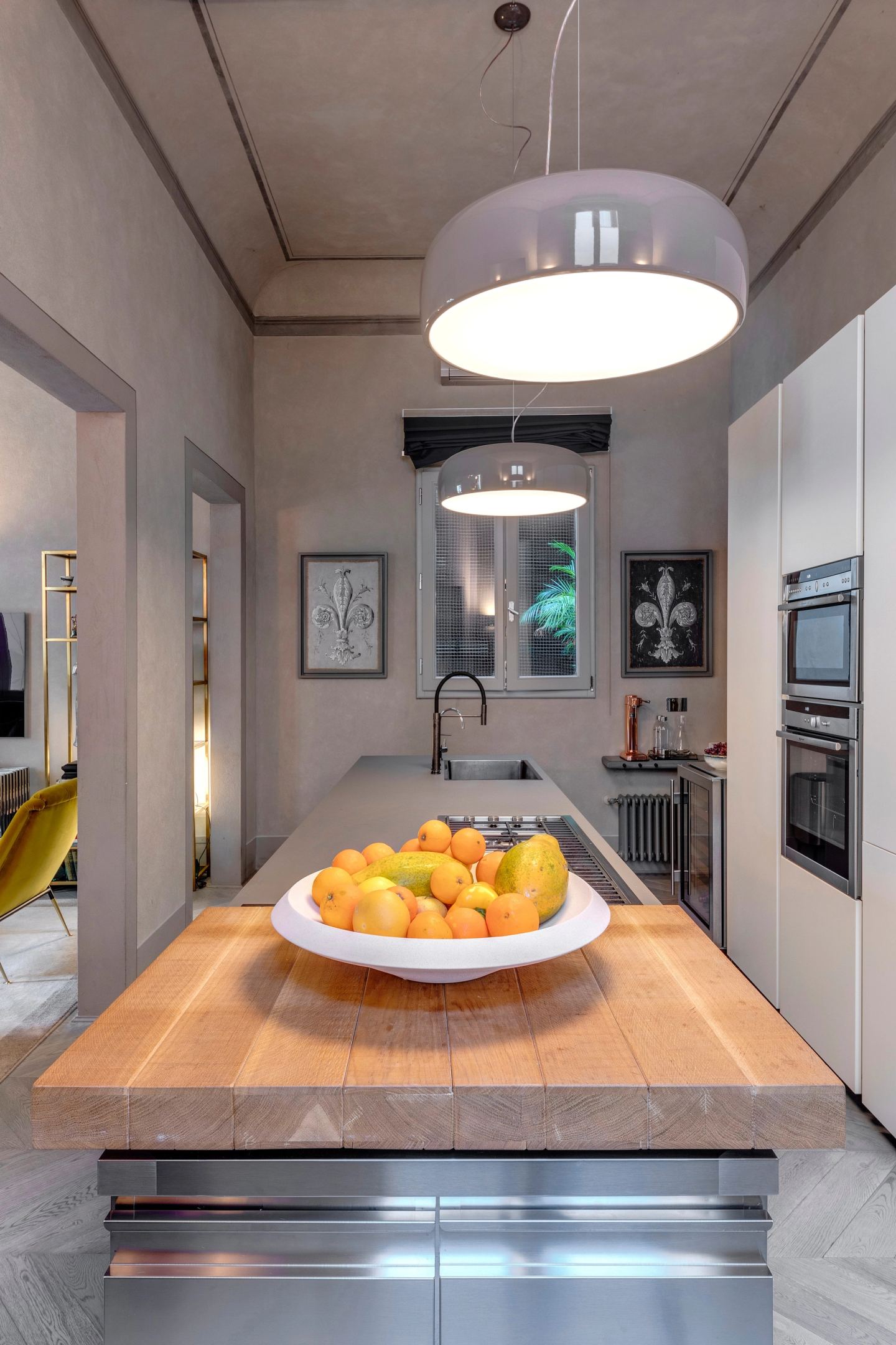The kitchen island from the end, the pendants in a line above