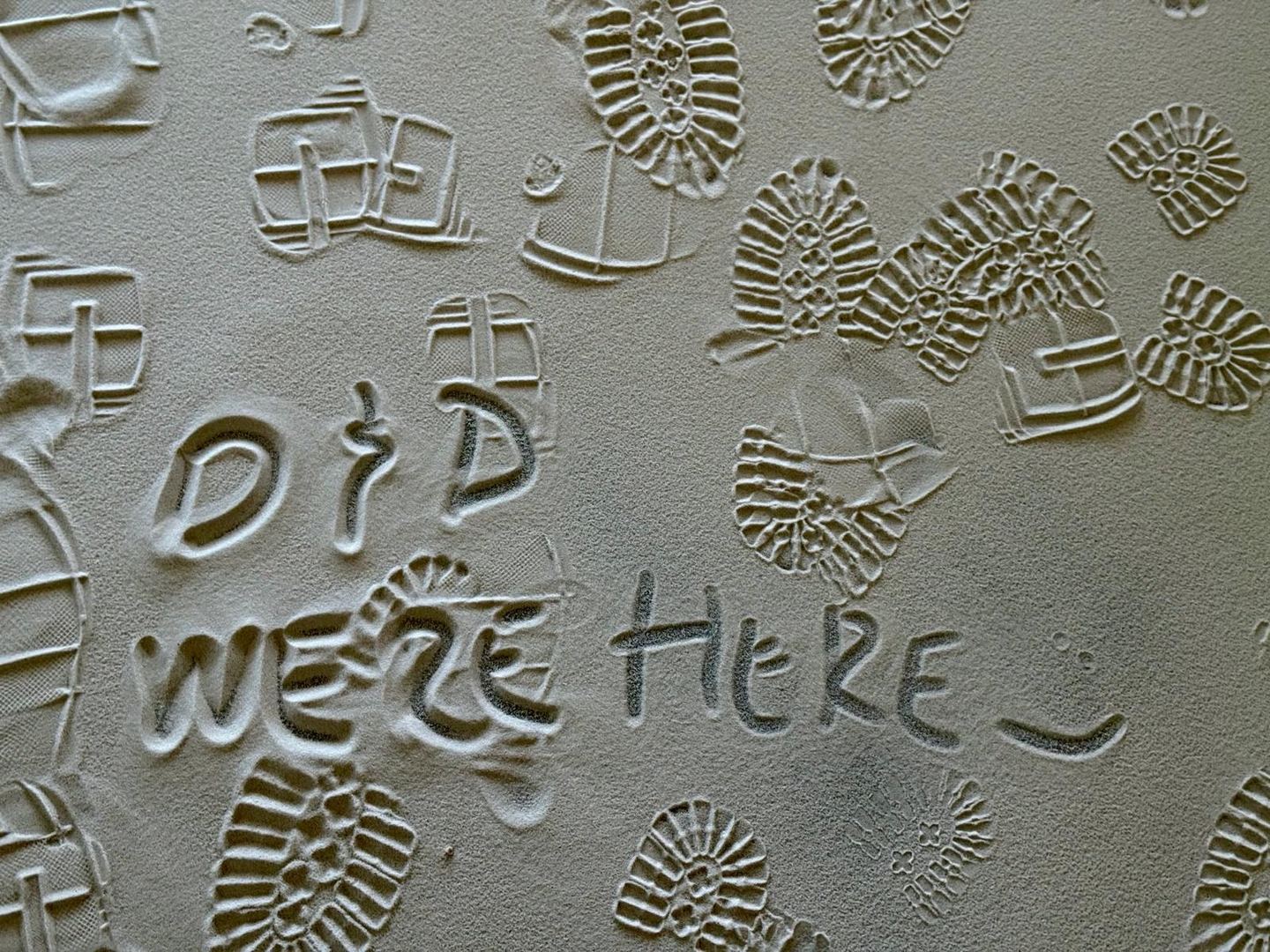 “D&D were here”, written into the fresh plaster among the footprints