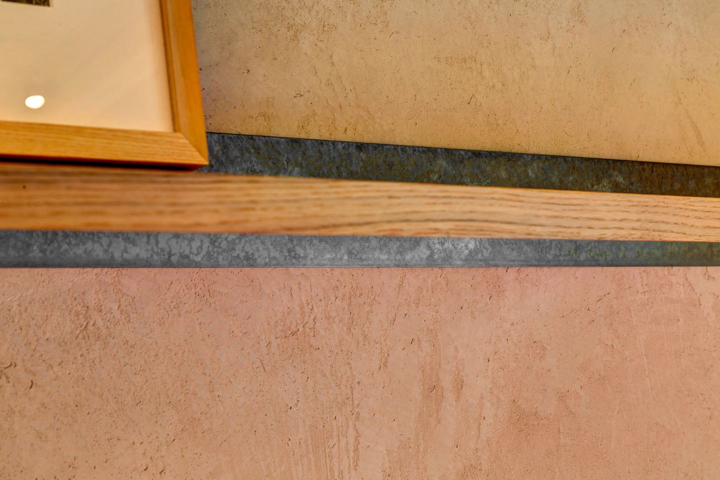 Stone sill meeting timber