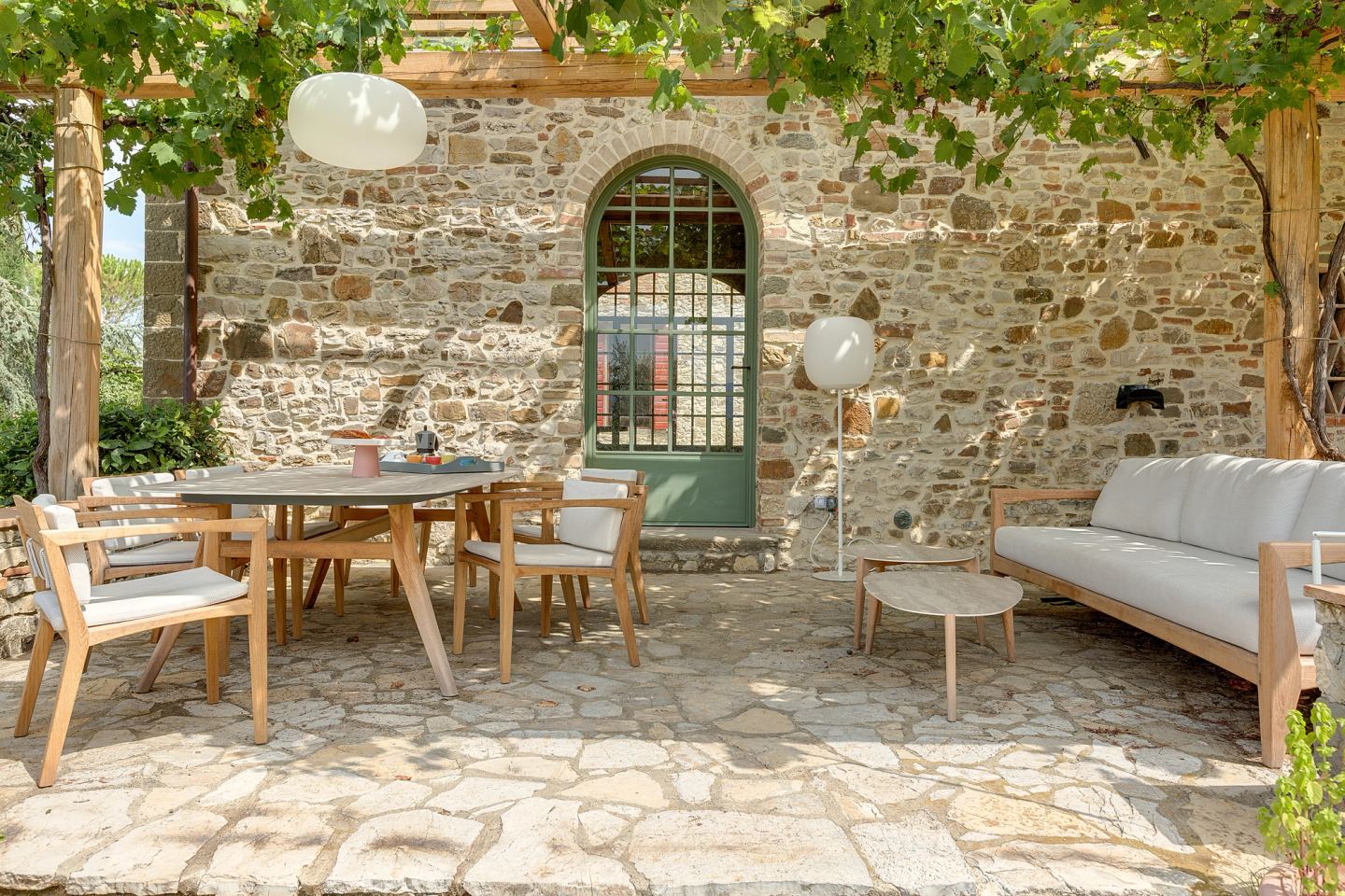 The daybed along the wall of the house