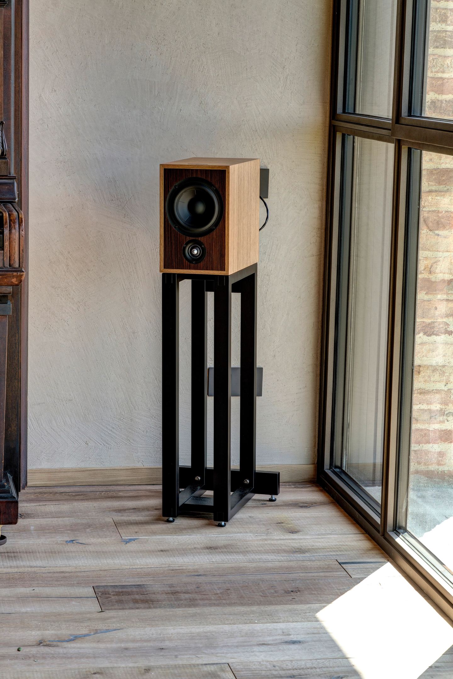 The speaker standing on its column