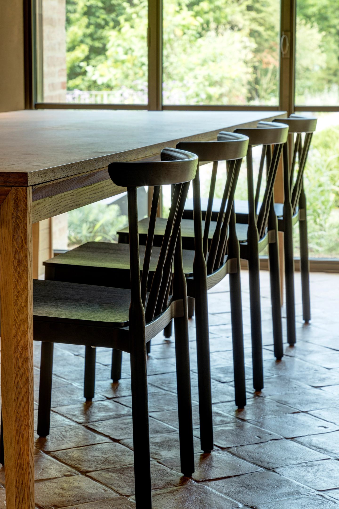 The table and its chairs in window light
