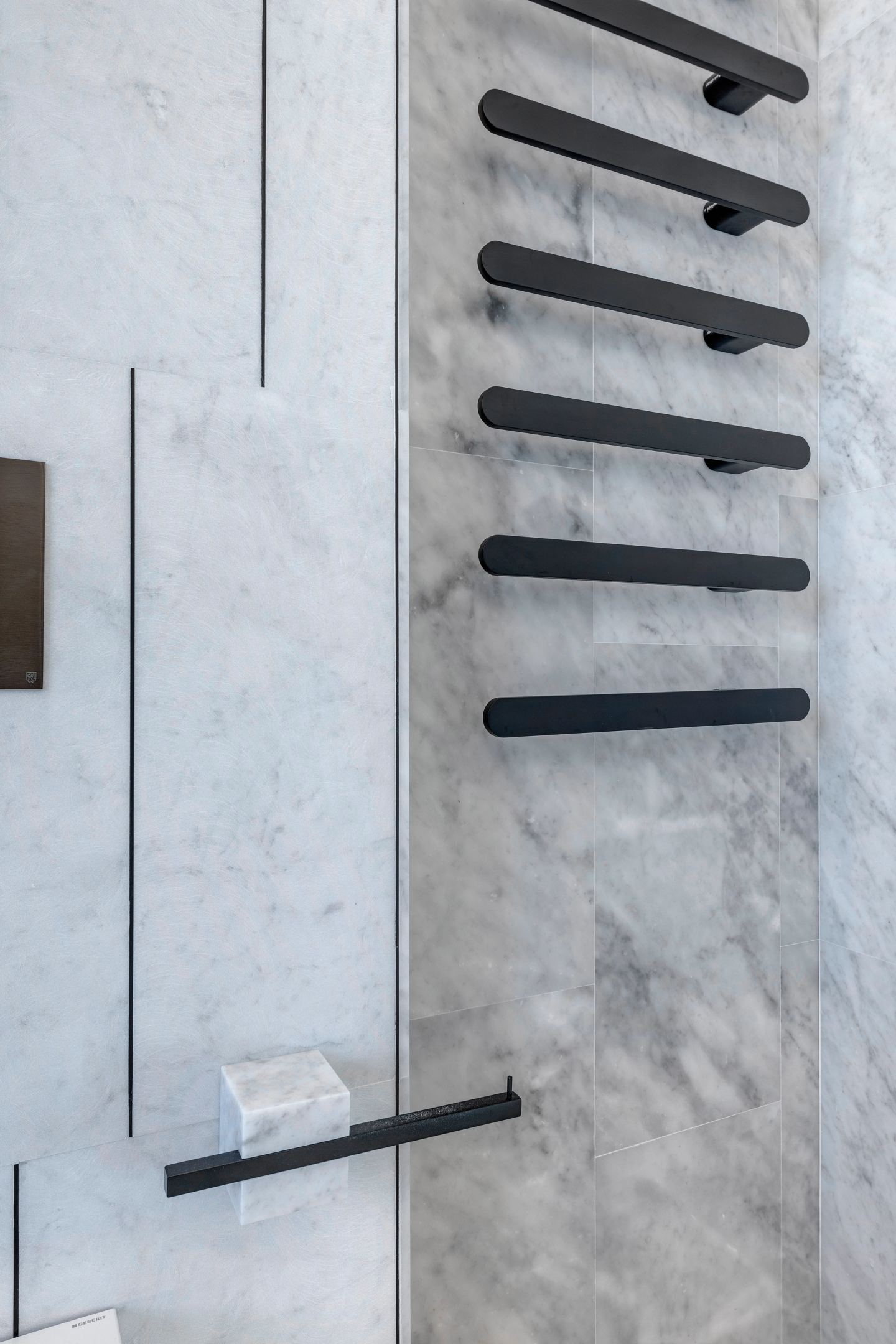The heated rail and a marble soap shelf, detail