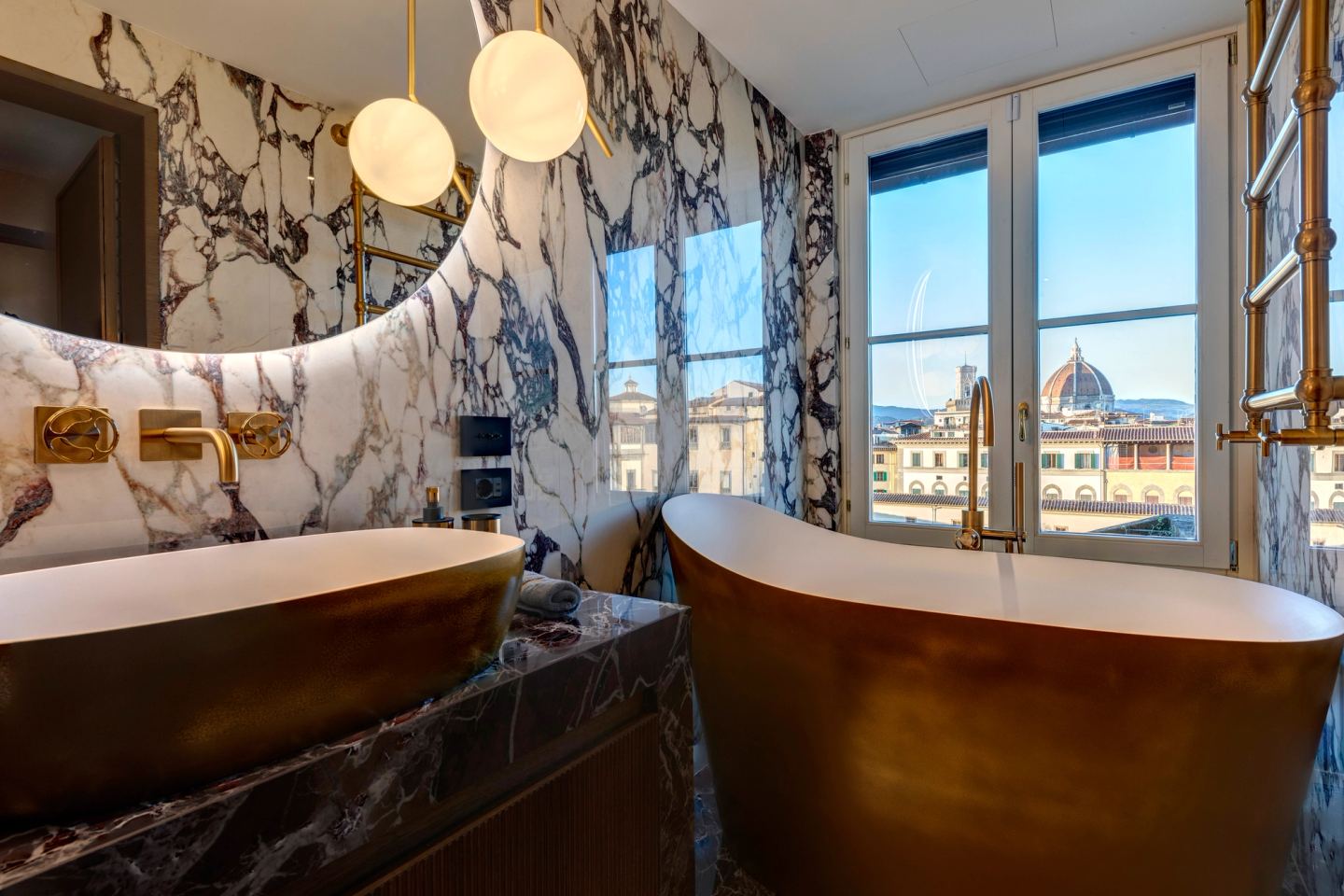 The bathroom from the door, bath below the window