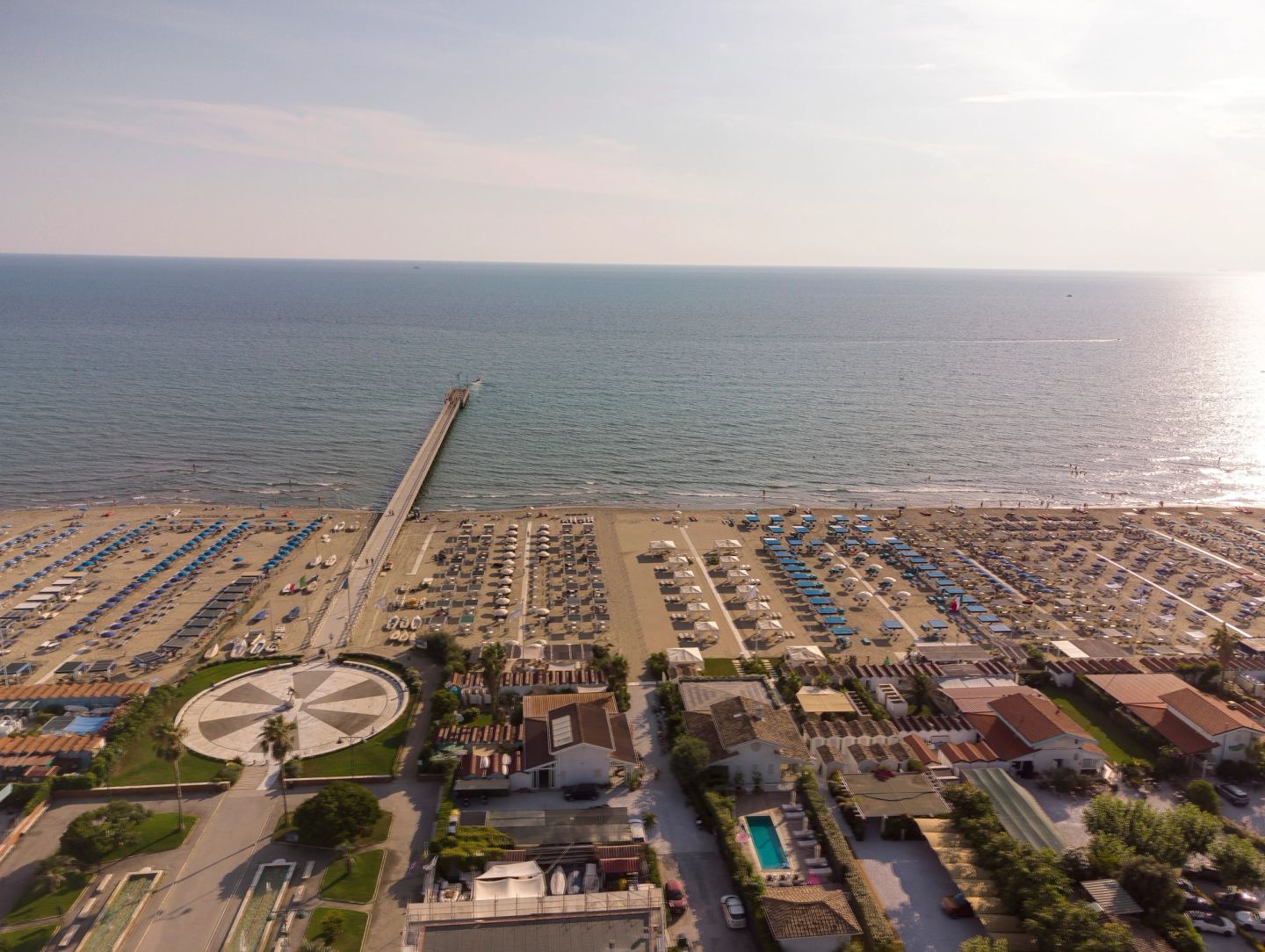 The beach clubs and the pier by day