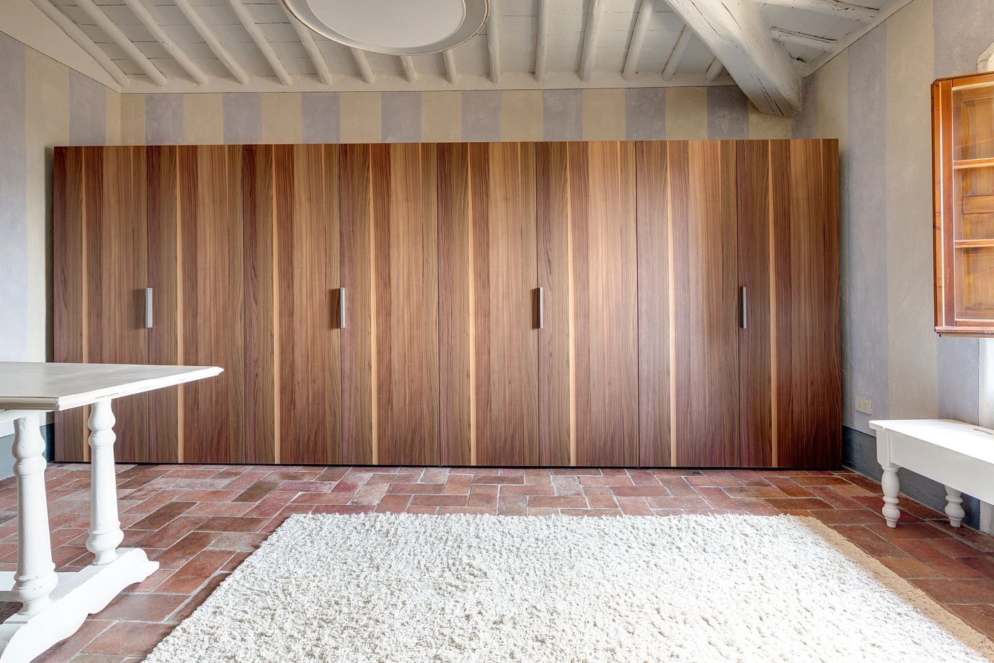 The full run of wardrobes, handles flush