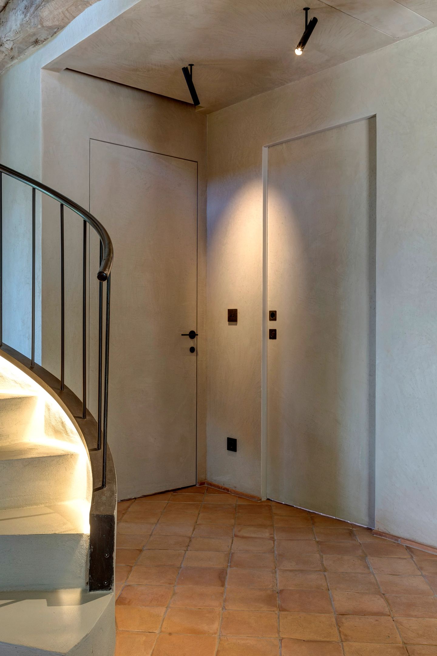 The foot of the stair, the doors beyond it